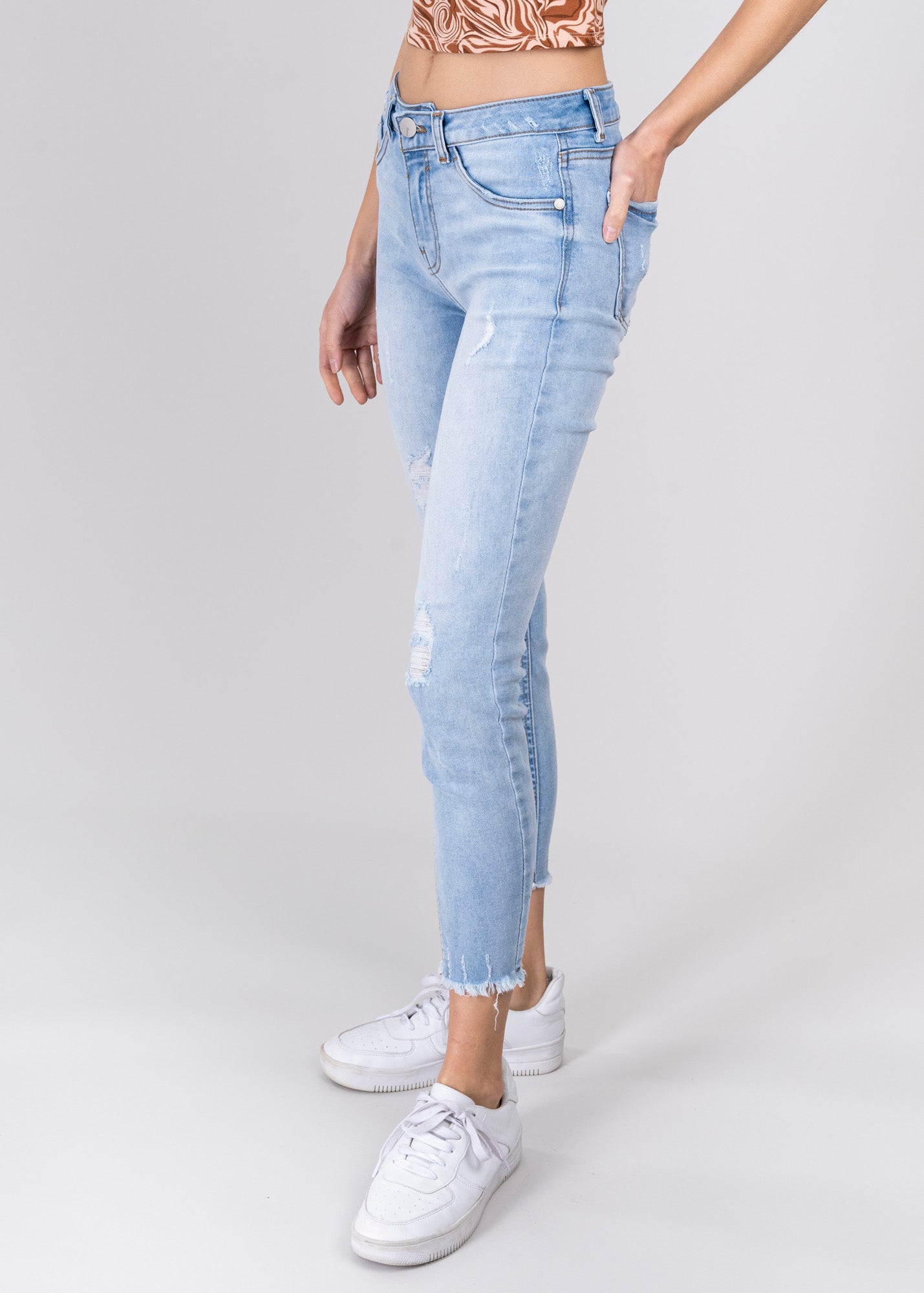 Jeans cintura media destrucciones flecos LIGHT WASH
