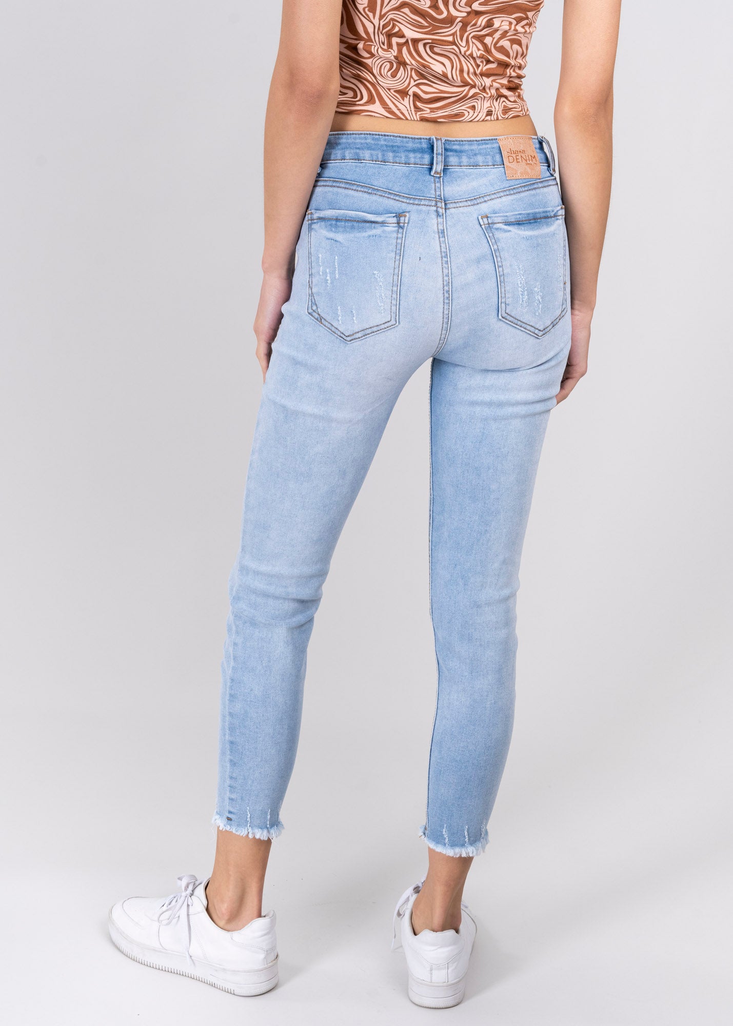 Jeans cintura media destrucciones flecos LIGHT WASH