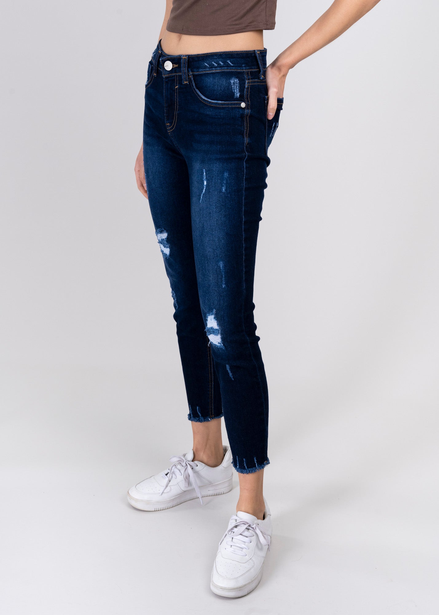 Jeans cintura media destrucciones flecos RINSE