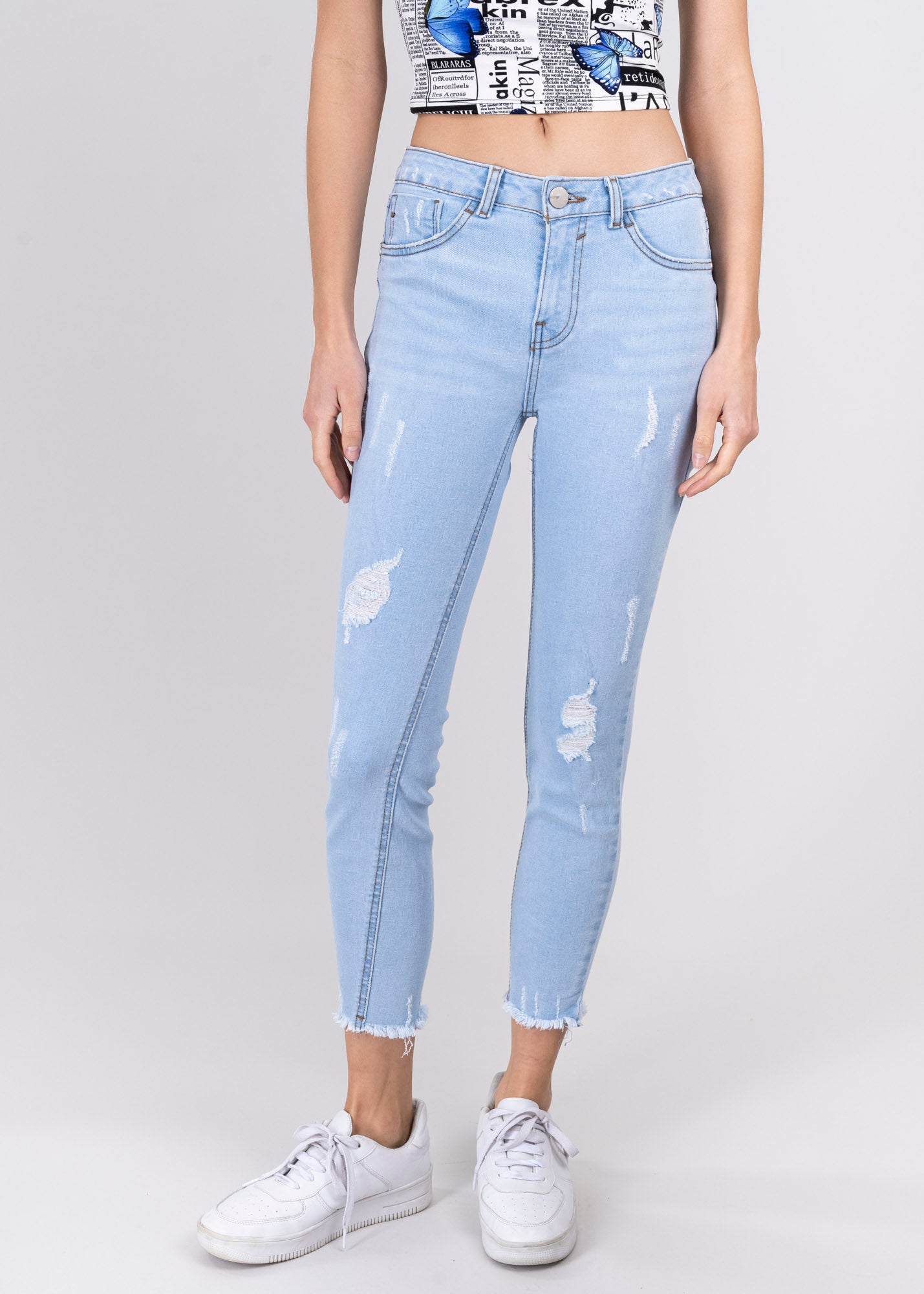 Jeans cintura media destrucciones flecos BLEACHED