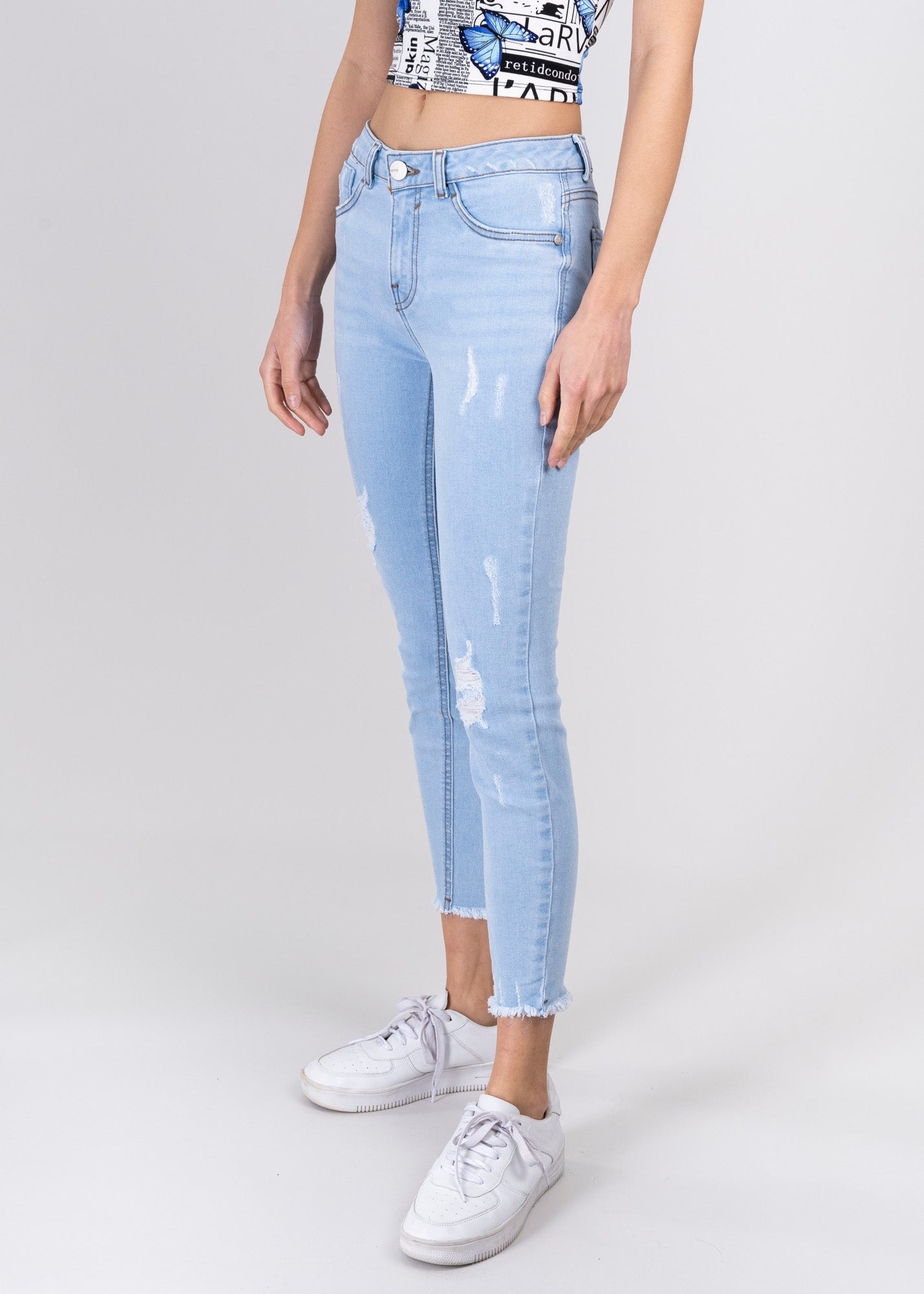 Jeans cintura media destrucciones flecos BLEACHED