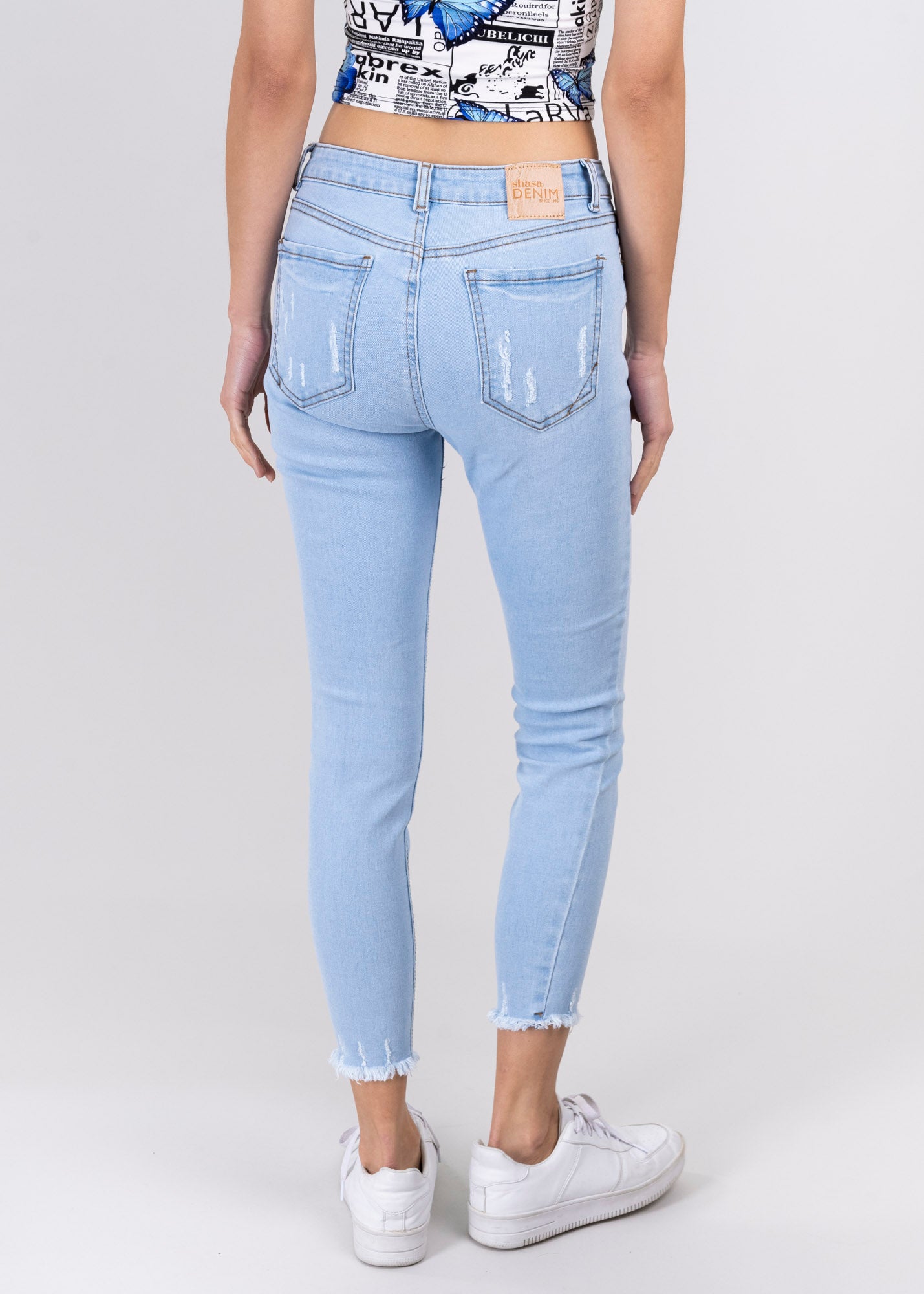 Jeans cintura media destrucciones flecos BLEACHED