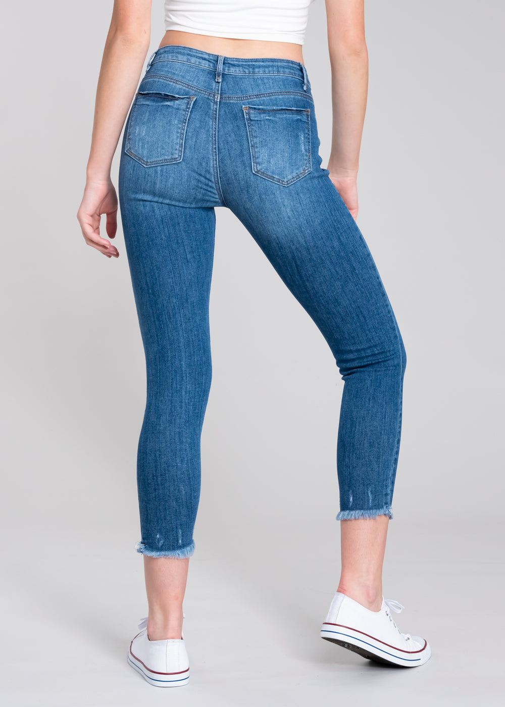Jeans cintura media destrucciones flecos MEDIUM WASH
