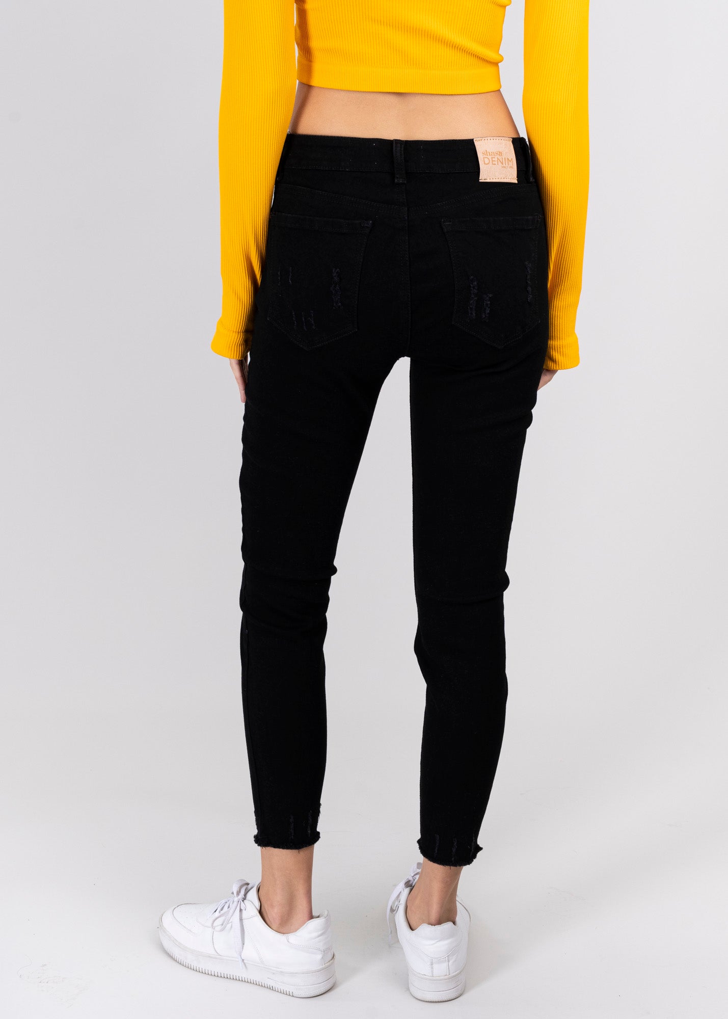 Jeans cintura media destrucciones flecos NEGRO
