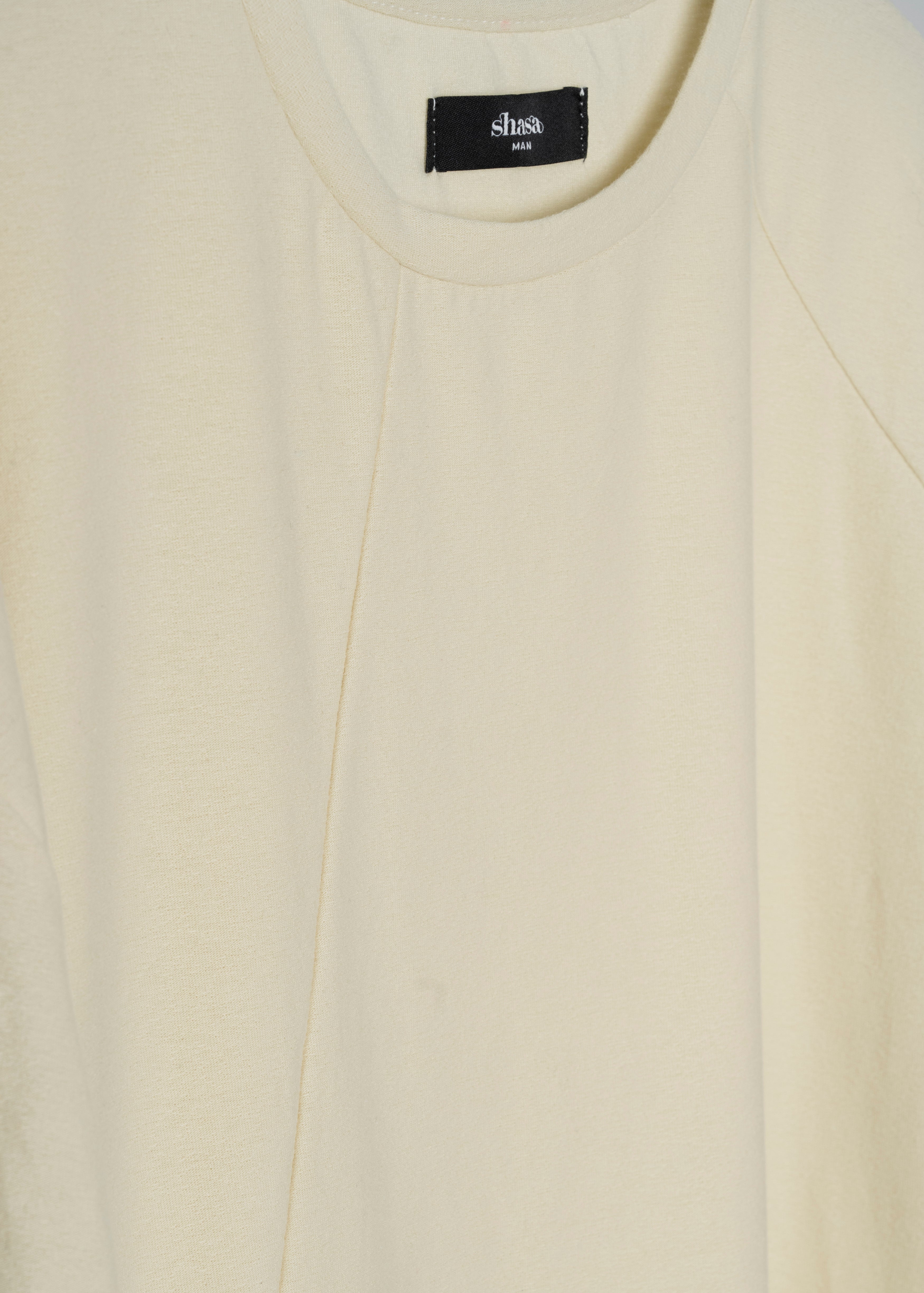 Playera manga corta costuras HUESO