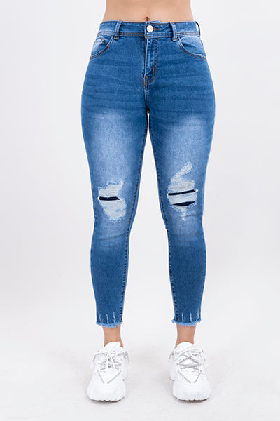 Jeans skinny con parches en rodillas