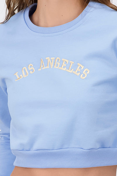 Sudadera crop Los Angeles AZUL CIELO