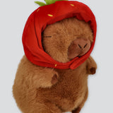 Peluche capibara gorro fresa