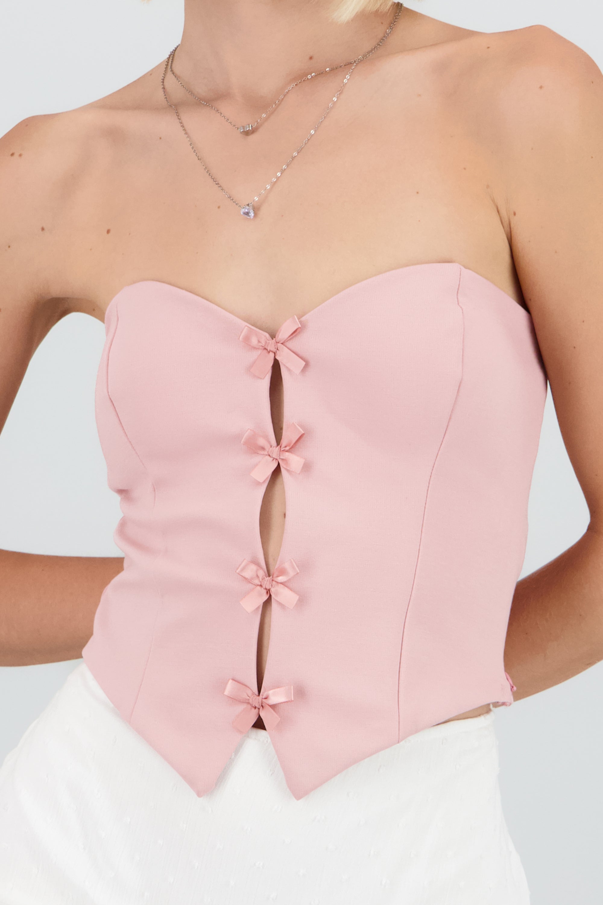 Top strapless detalle moños ROSA PASTEL