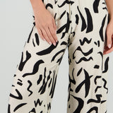 Pantalon fluido detalle estampado