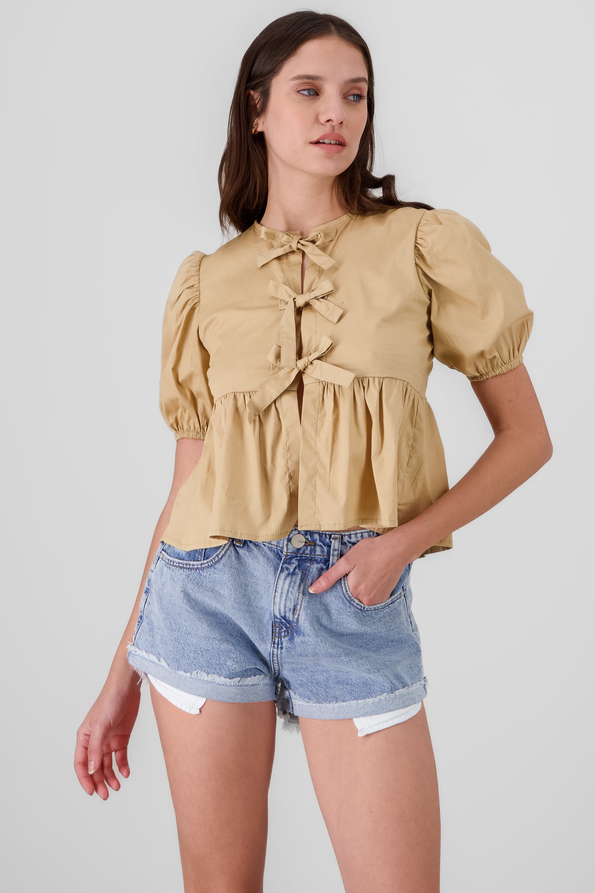 Blusa mangas abullonadas detalle moños TAN