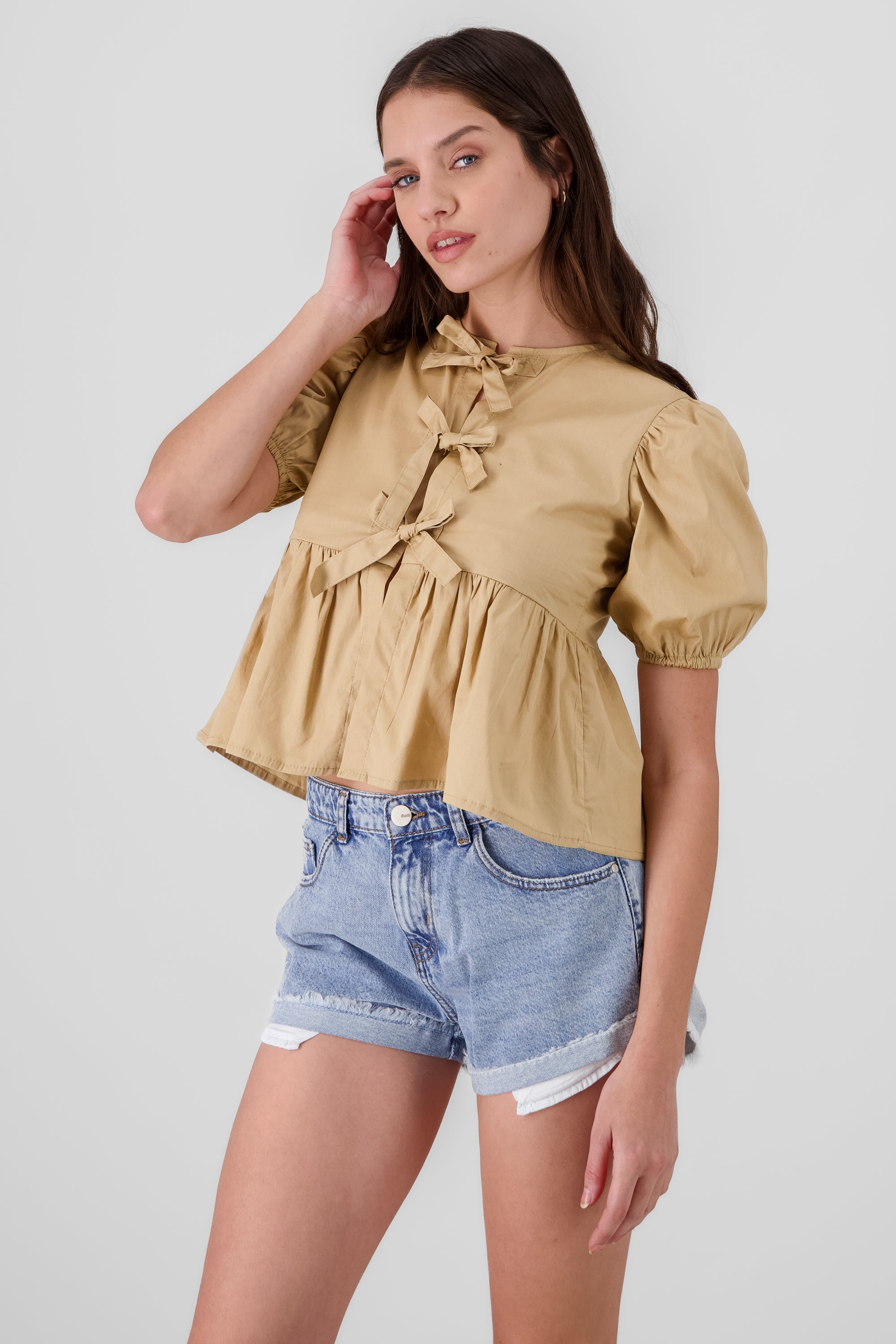 Blusa mangas abullonadas detalle moños TAN