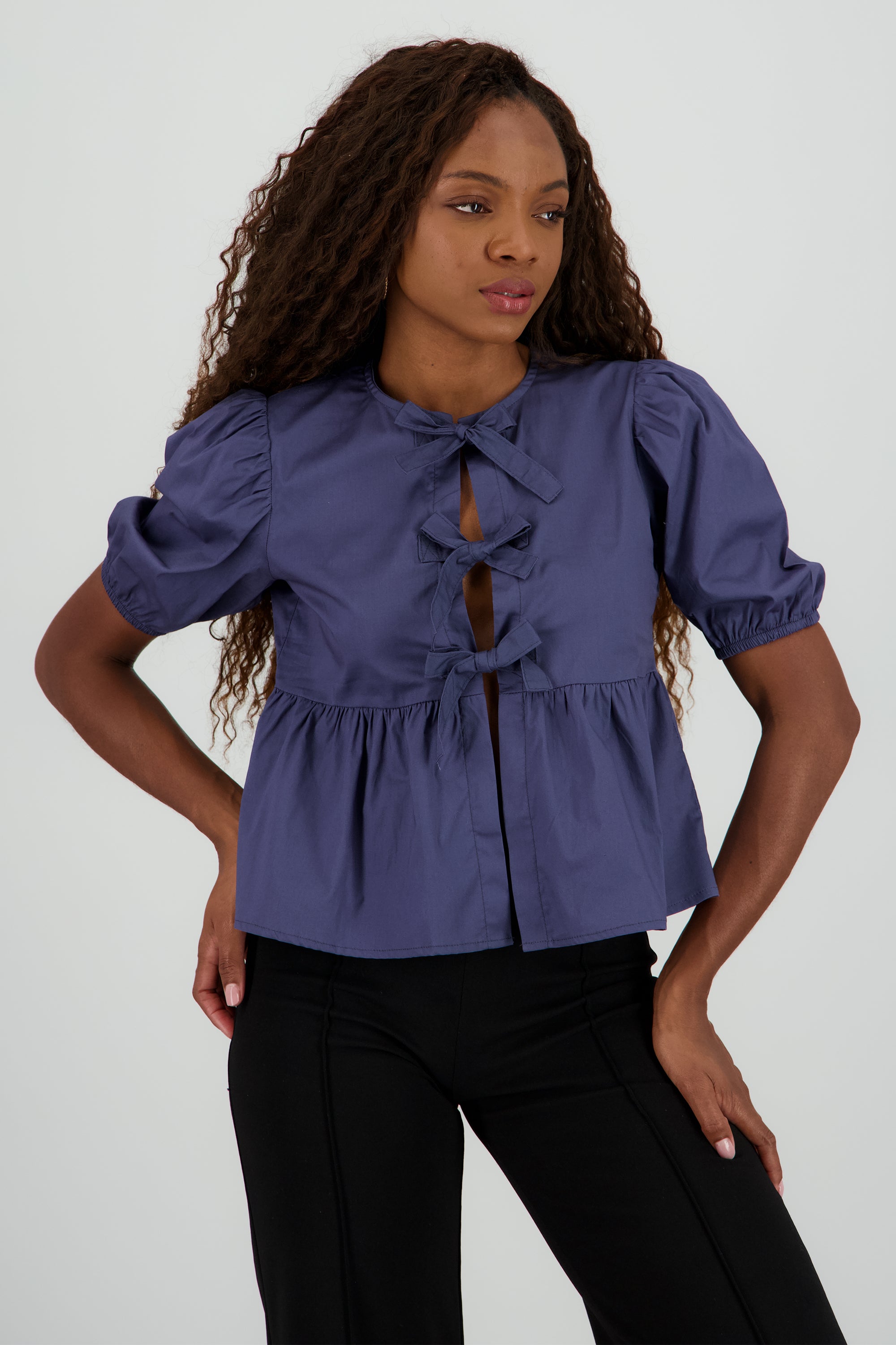 Blusa mangas abullonadas detalle moños INDIGO