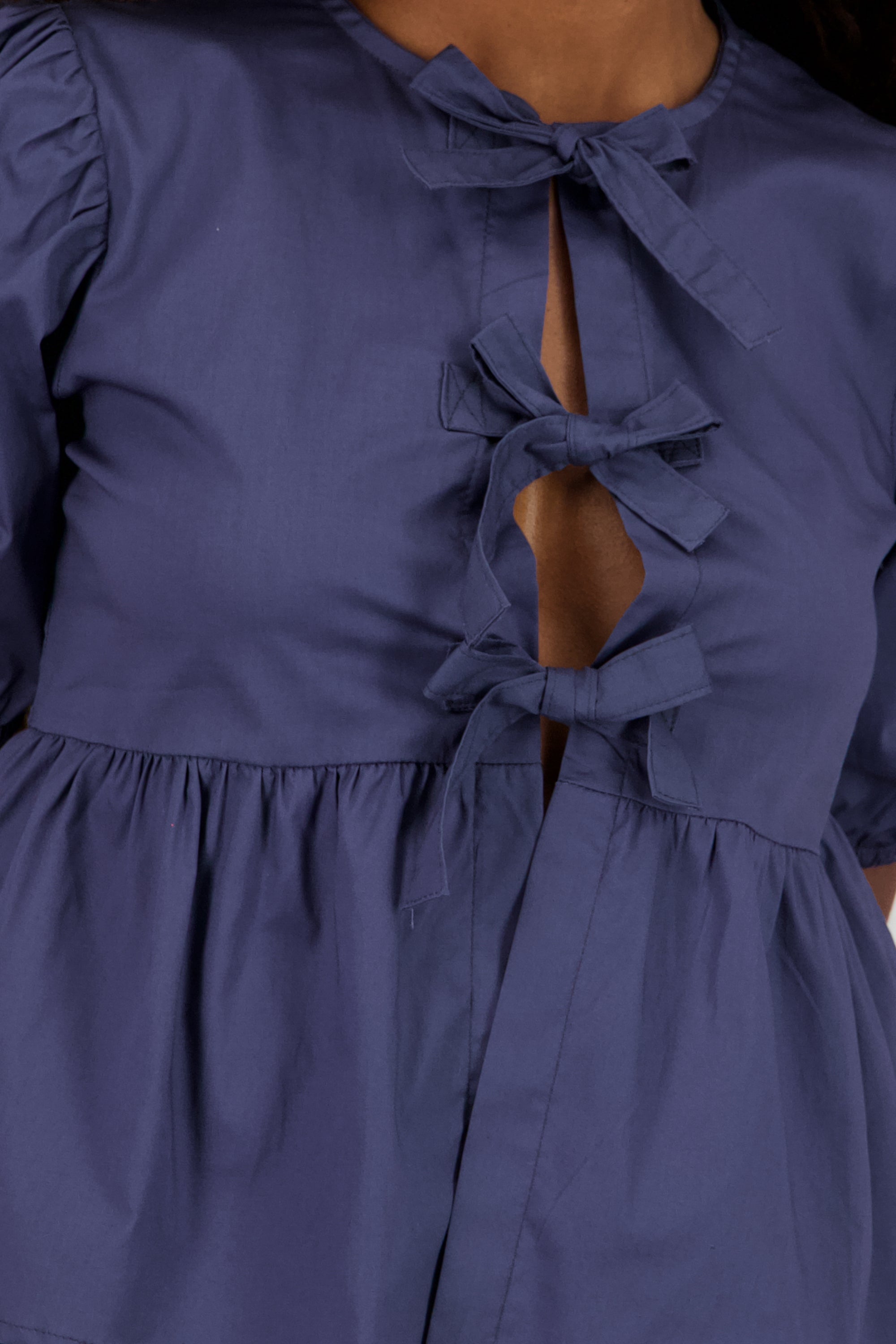 Blusa mangas abullonadas detalle moños INDIGO