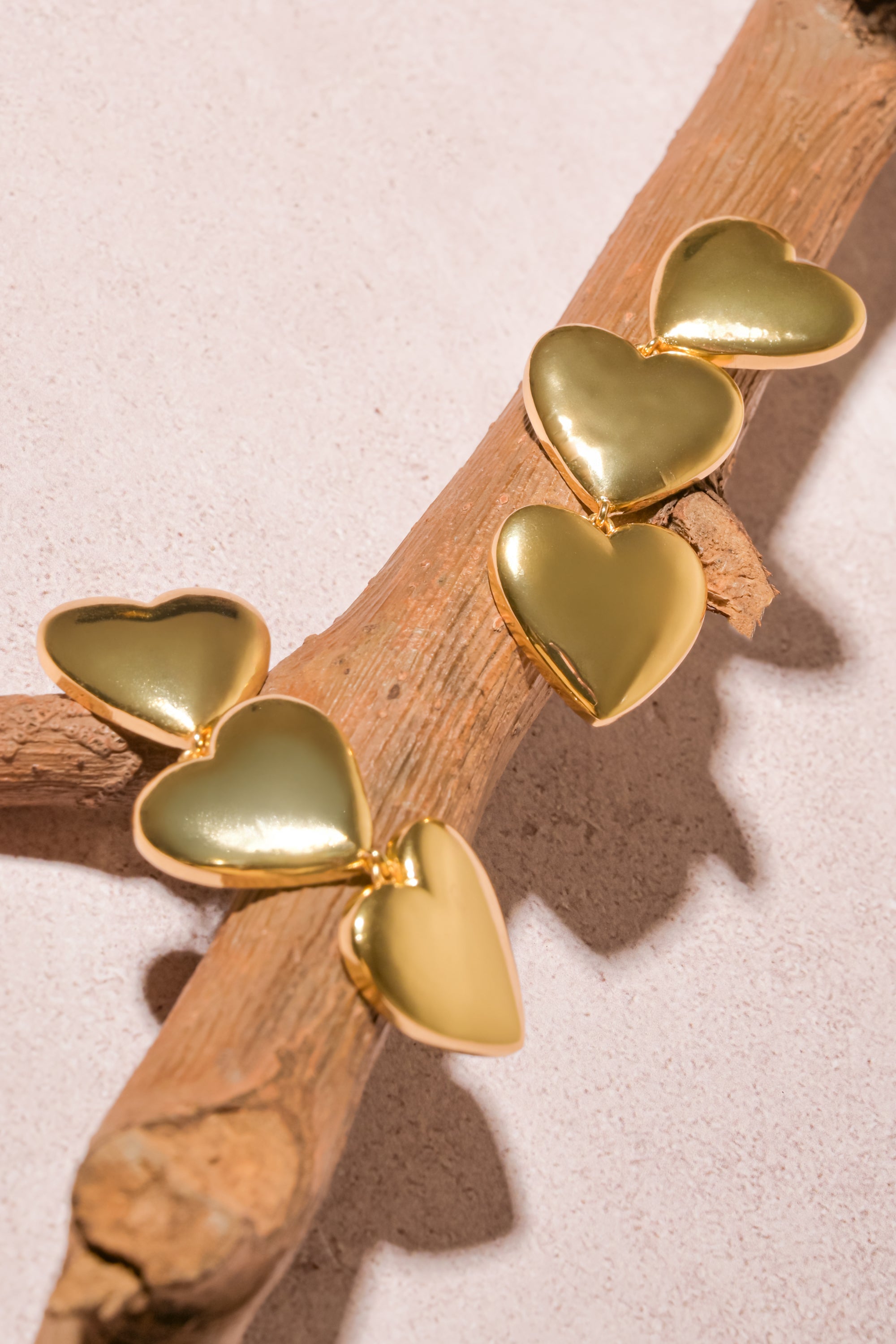 Aretes triple corazon ORO