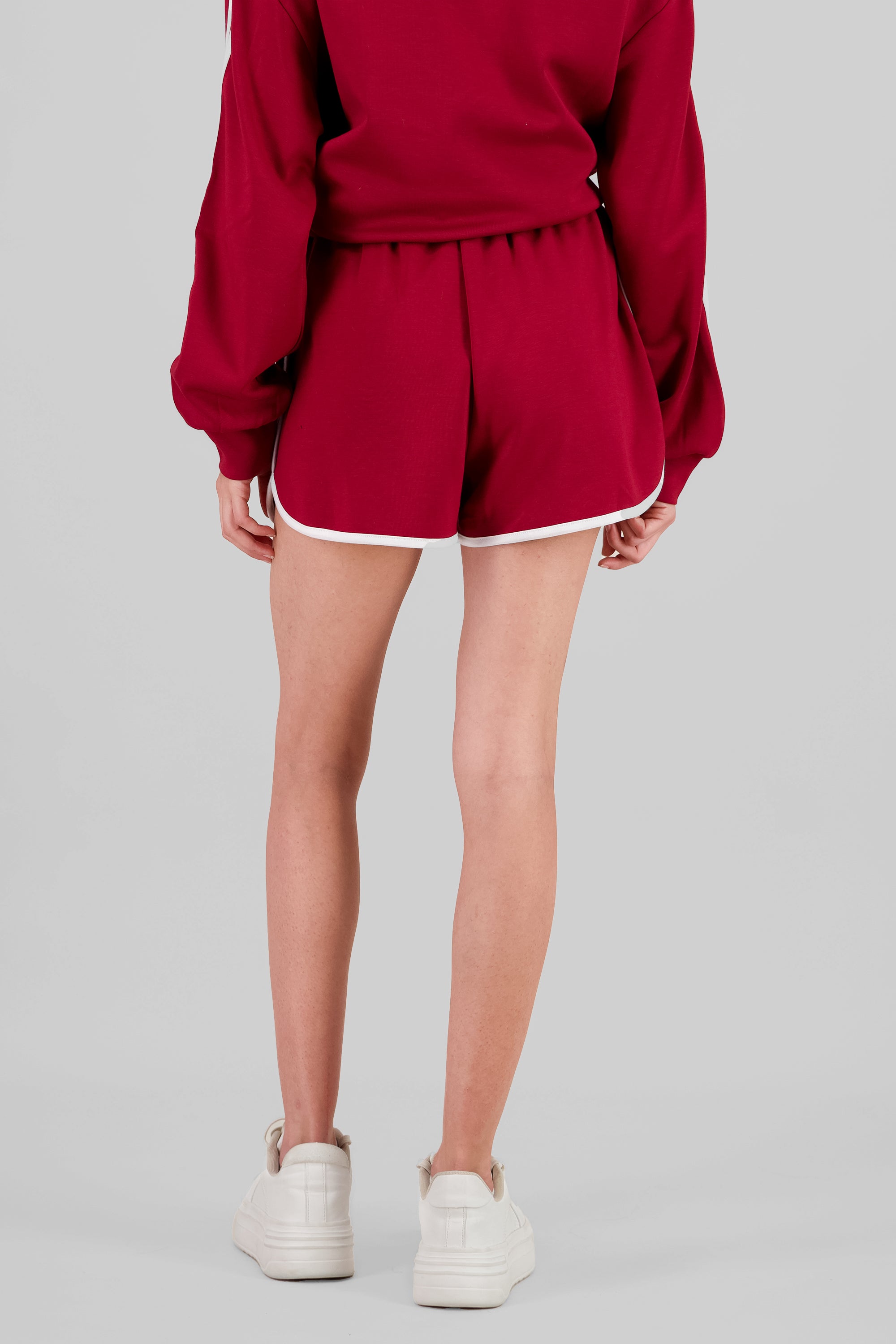 Shorts deportivos con detalle en ruedo ROJO QUEMADO