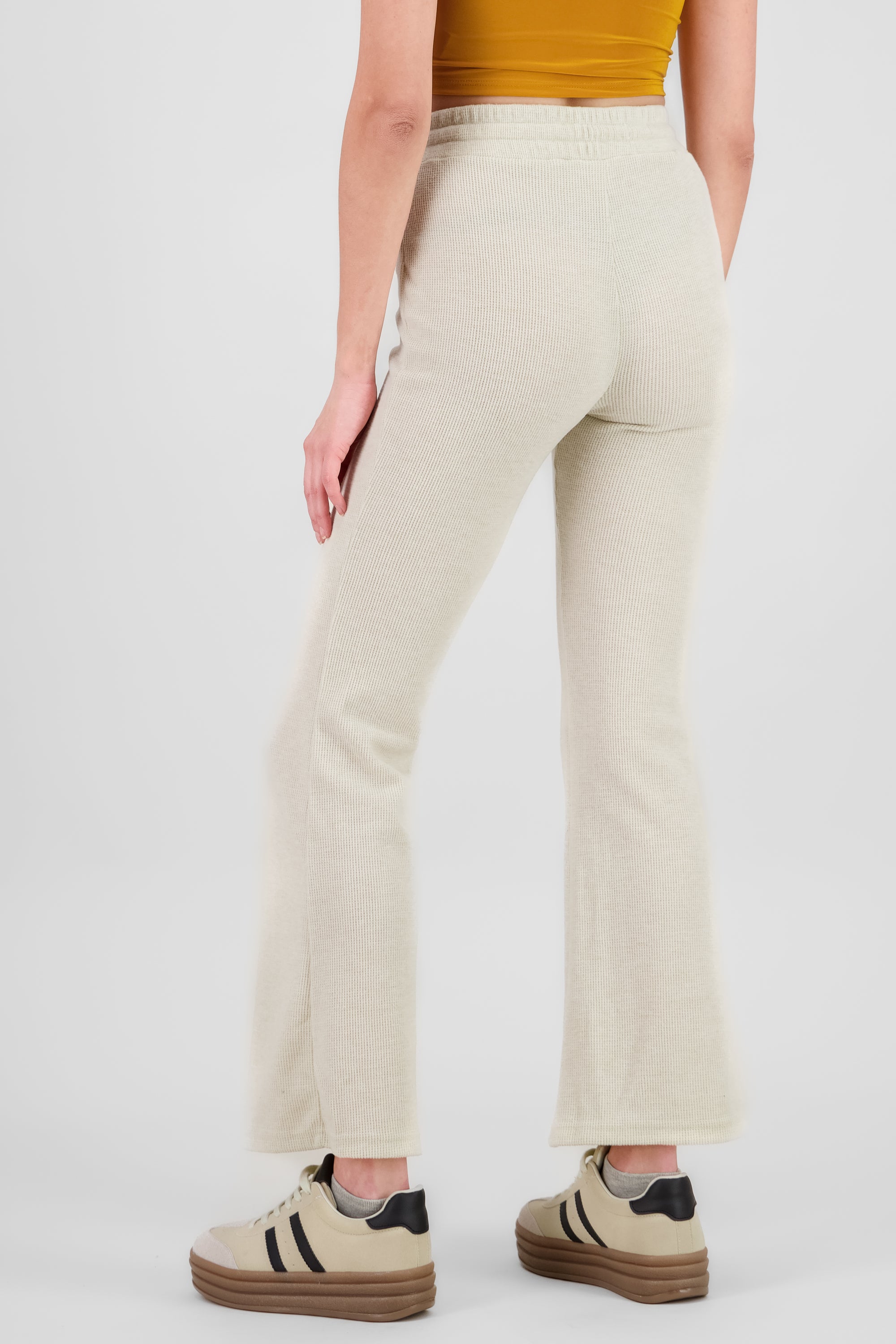 Pantalones tejidos flare CREMA