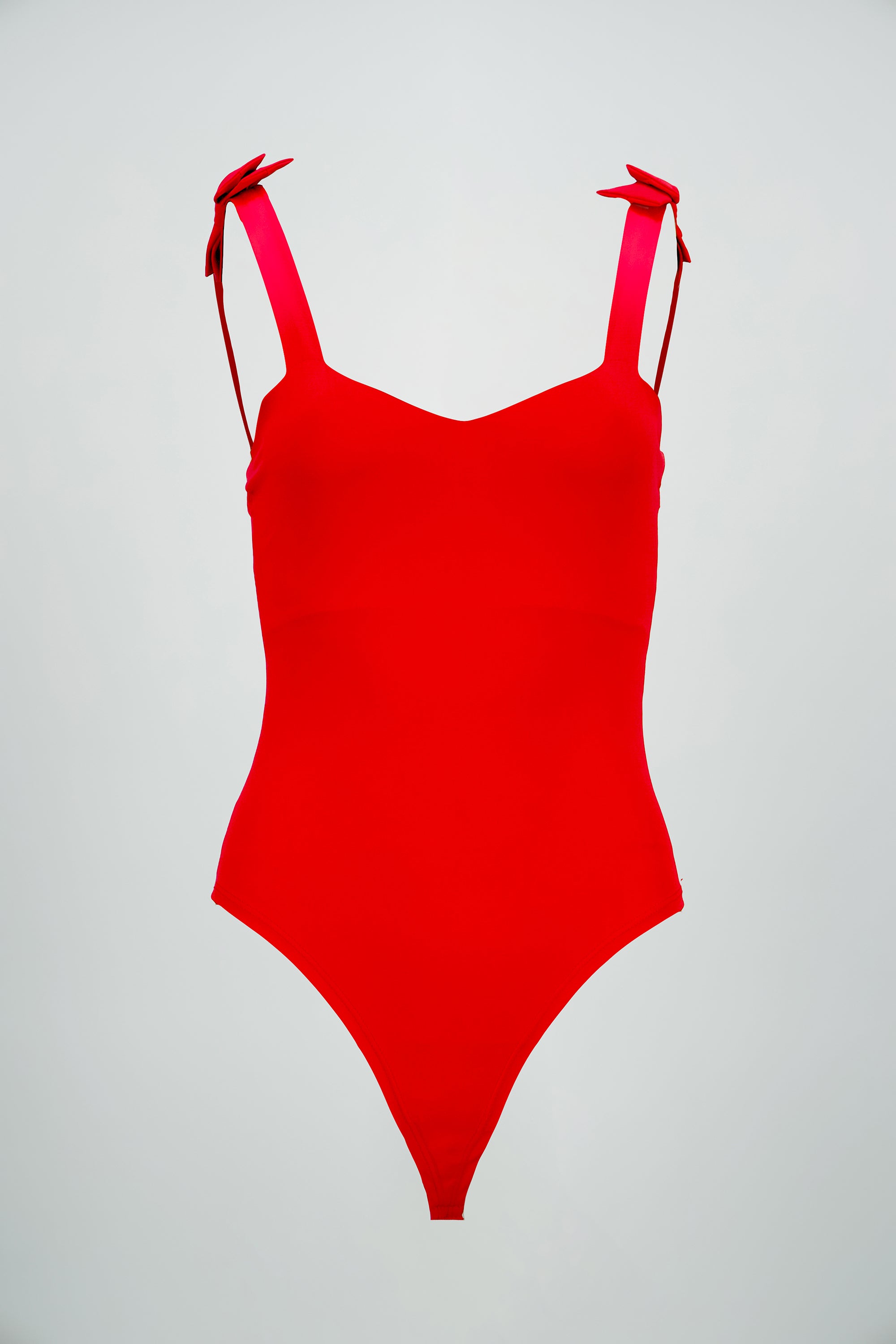 Bodysuit liso con tirante moños
