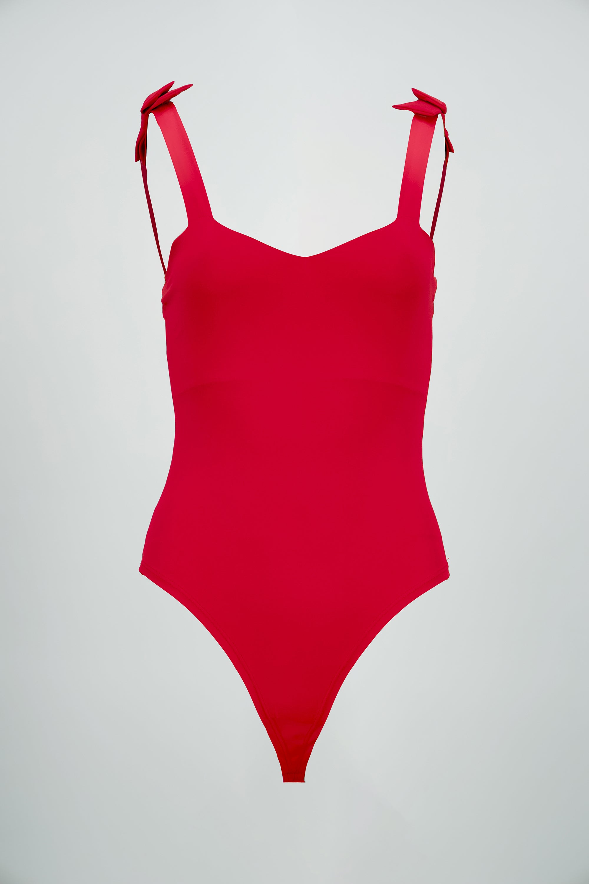 Bodysuit liso con tirante moños