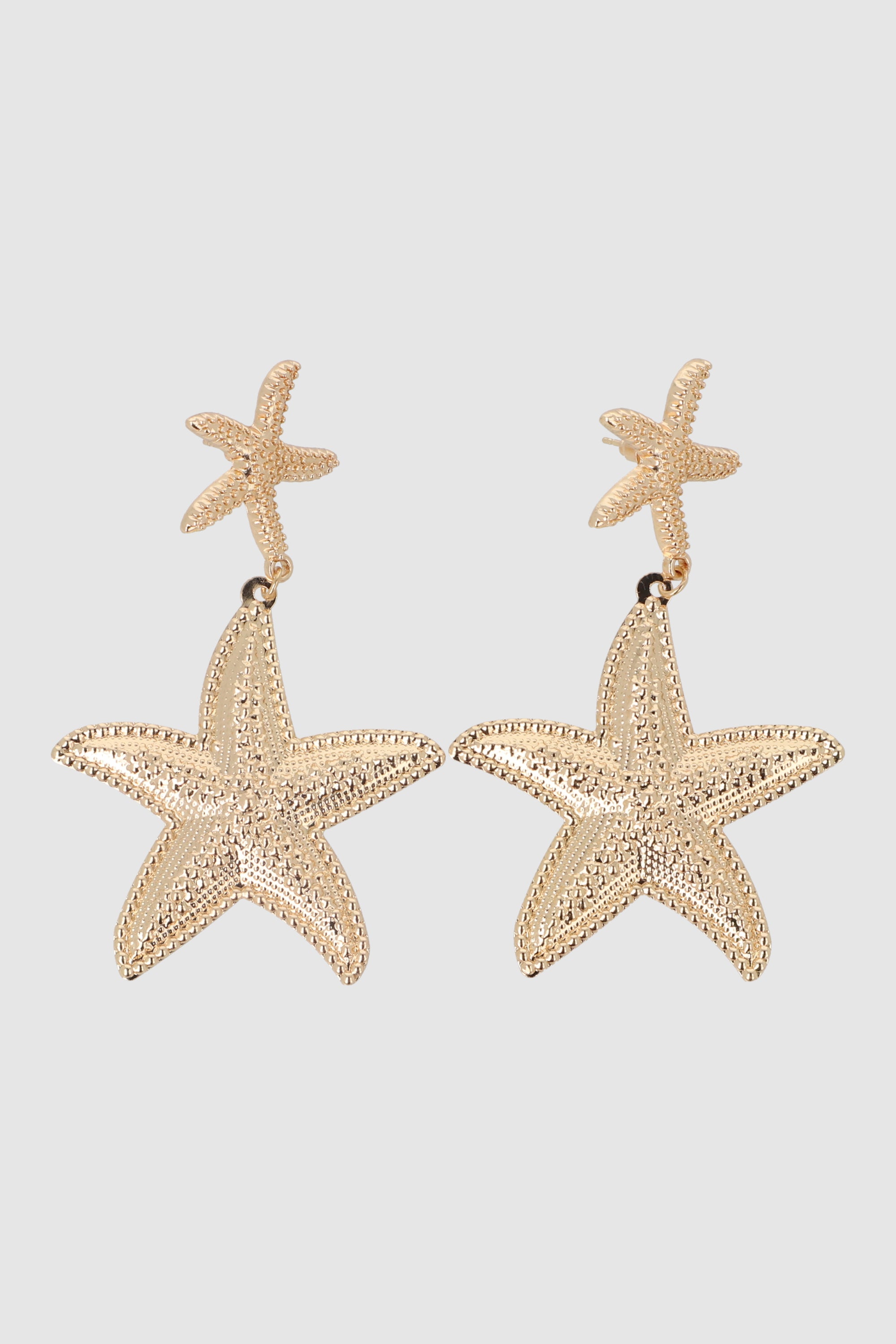 ARETES 2 ESTRELLAS DE MAR METAL ORO