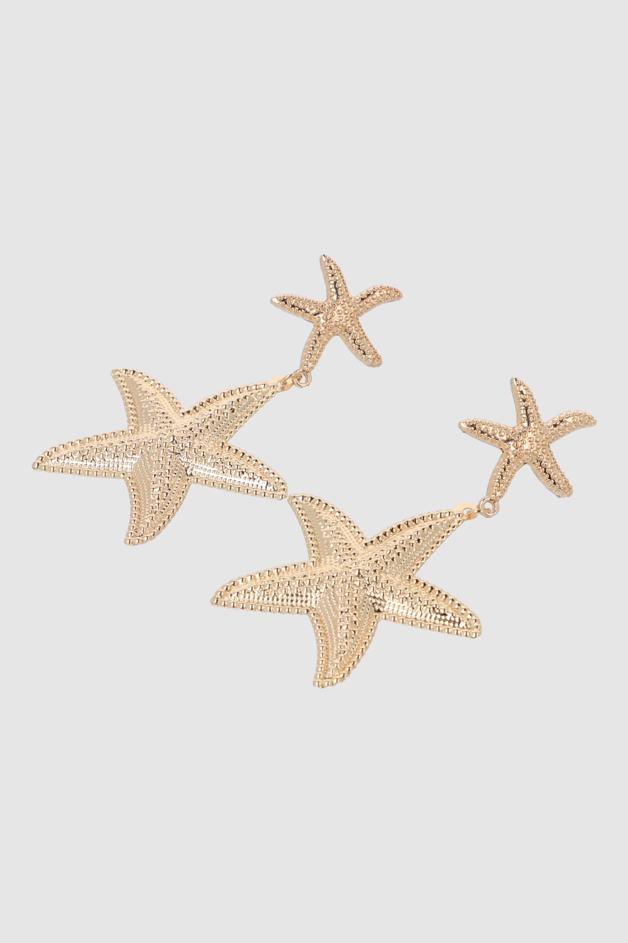 ARETES 2 ESTRELLAS DE MAR METAL ORO