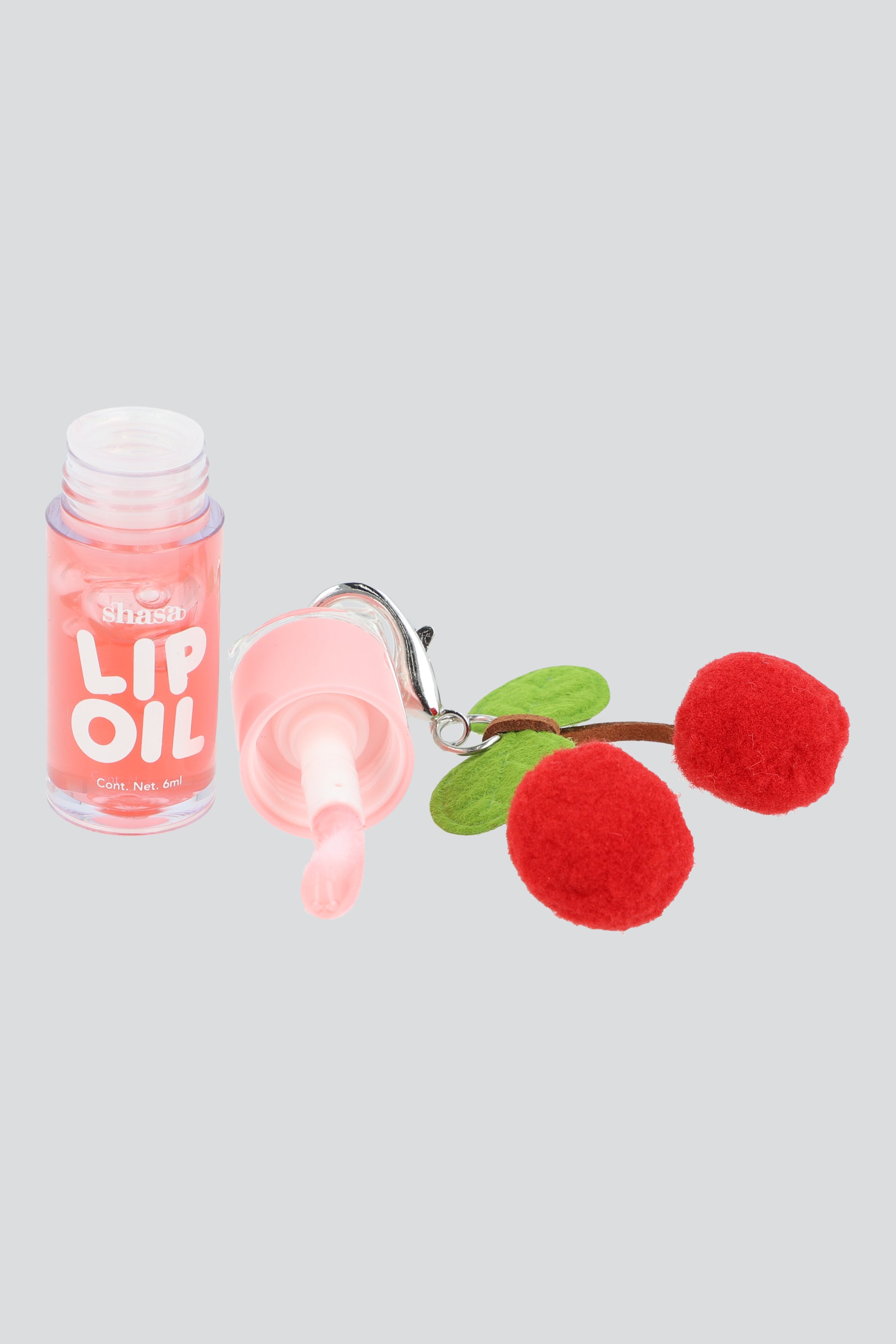 Lip oil charm cerezas pompon DURAZNO