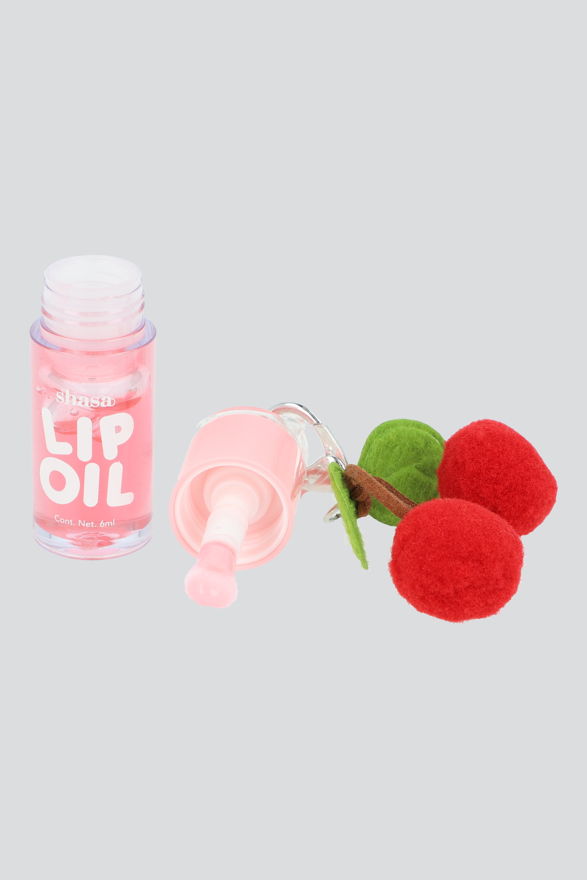 Lip oil charm cerezas pompon PALO DE ROSA