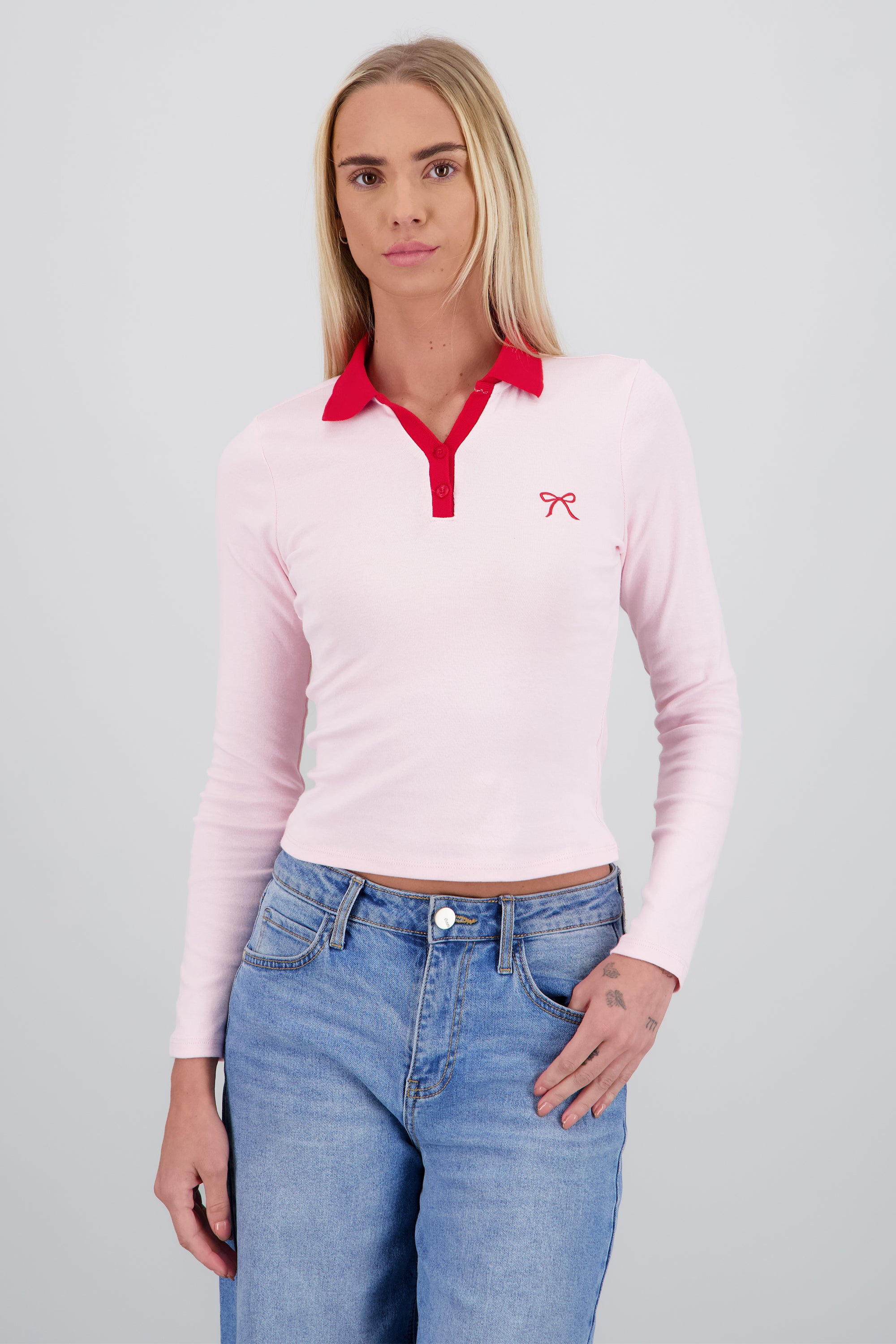 Top cuello polo bordado moño ROSA COMBO