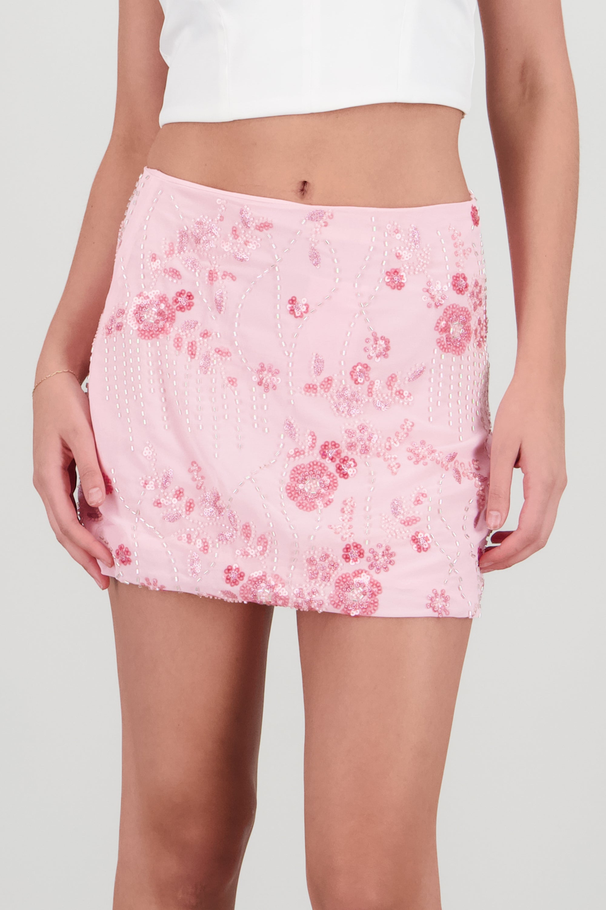 Falda mini detalle brillos flores ROSA