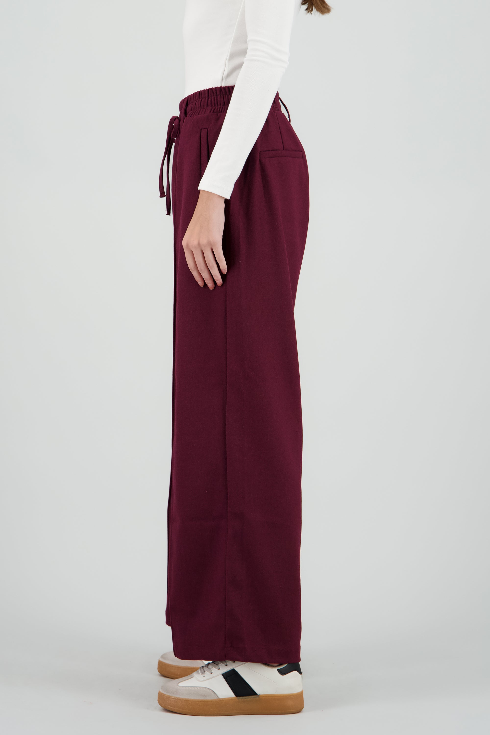 Pantalon amplio liso detalle resorte CIRUELA