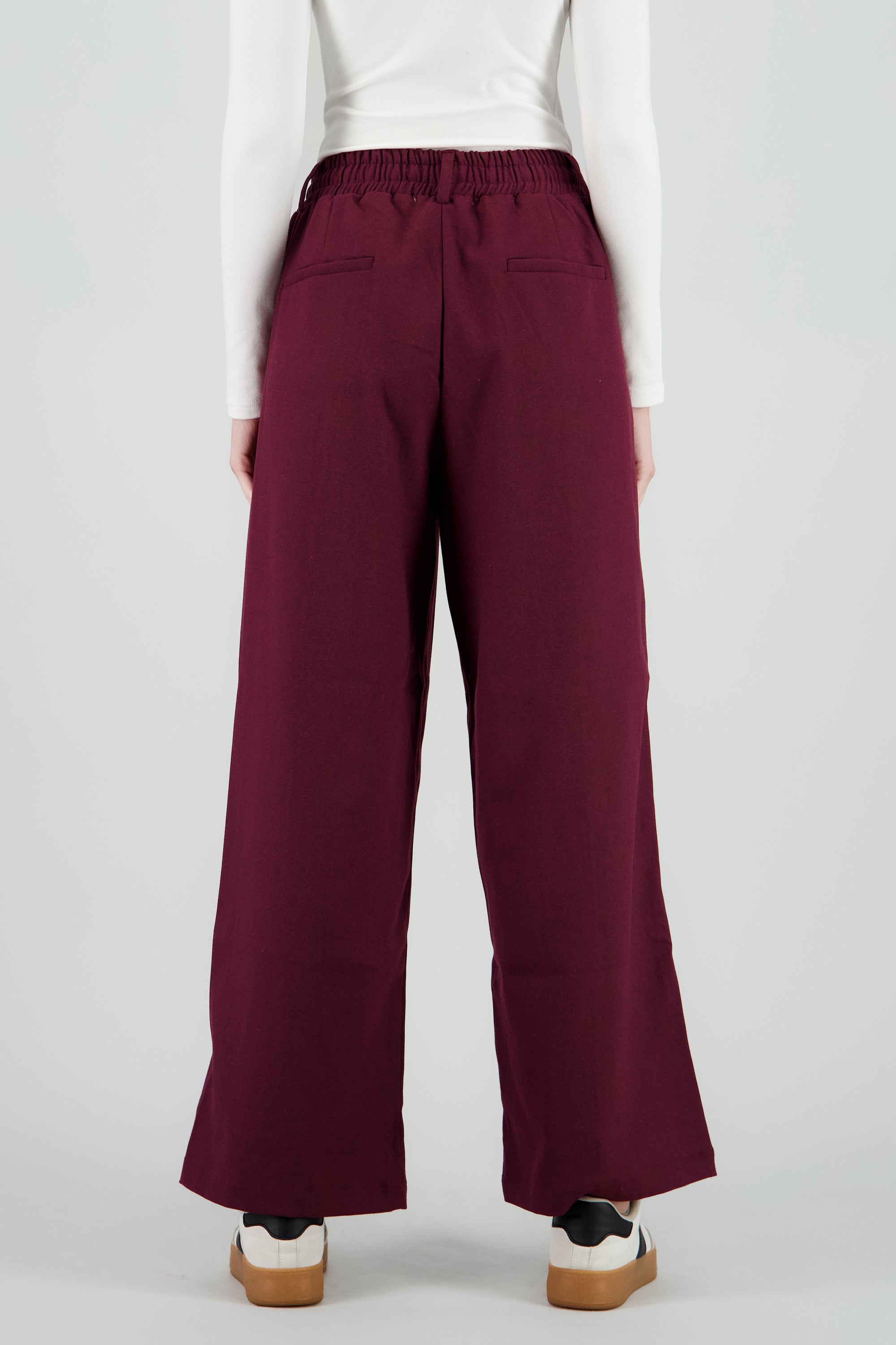 Pantalon amplio liso detalle resorte CIRUELA