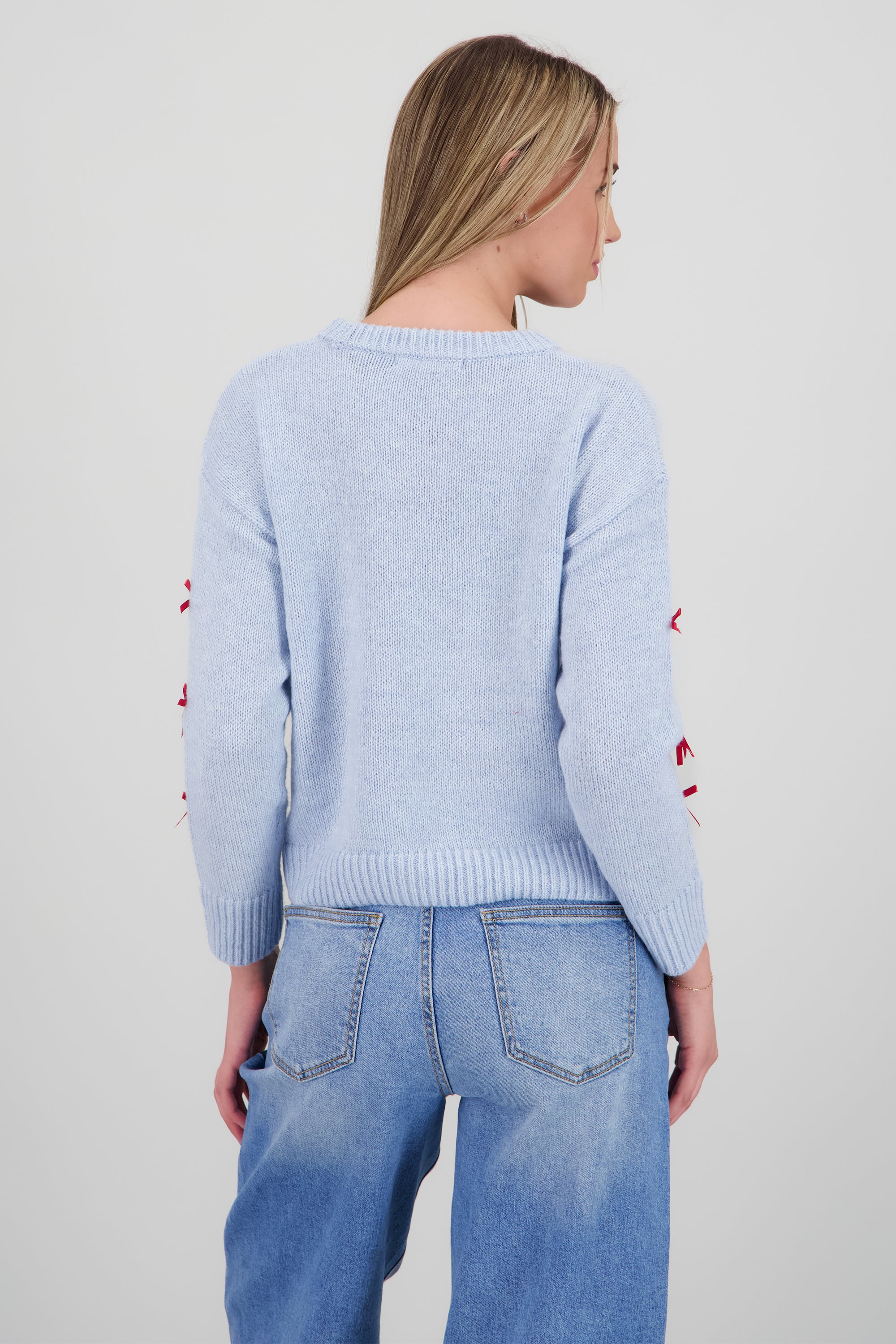 Sueter Santa Baby con moños AZUL CIELO