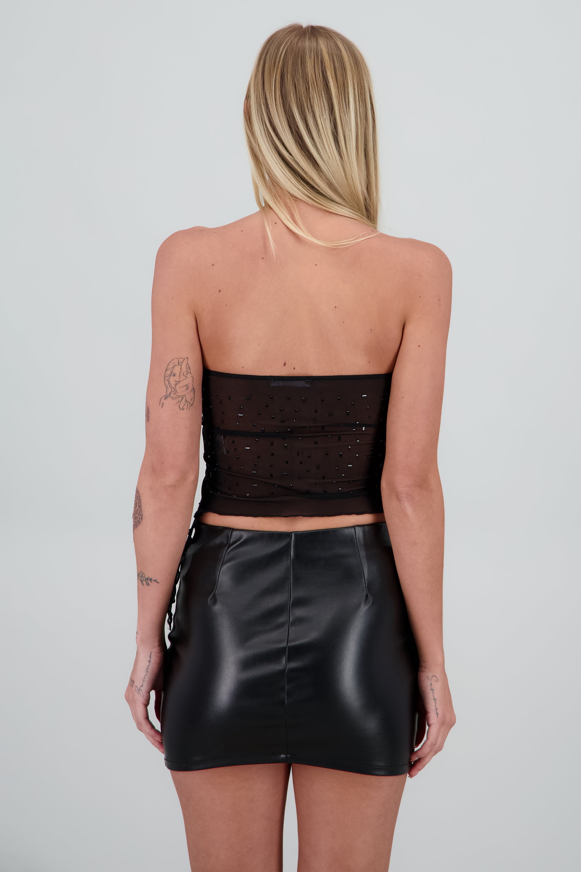 Top bandeau asimetrico con brillos NEGRO