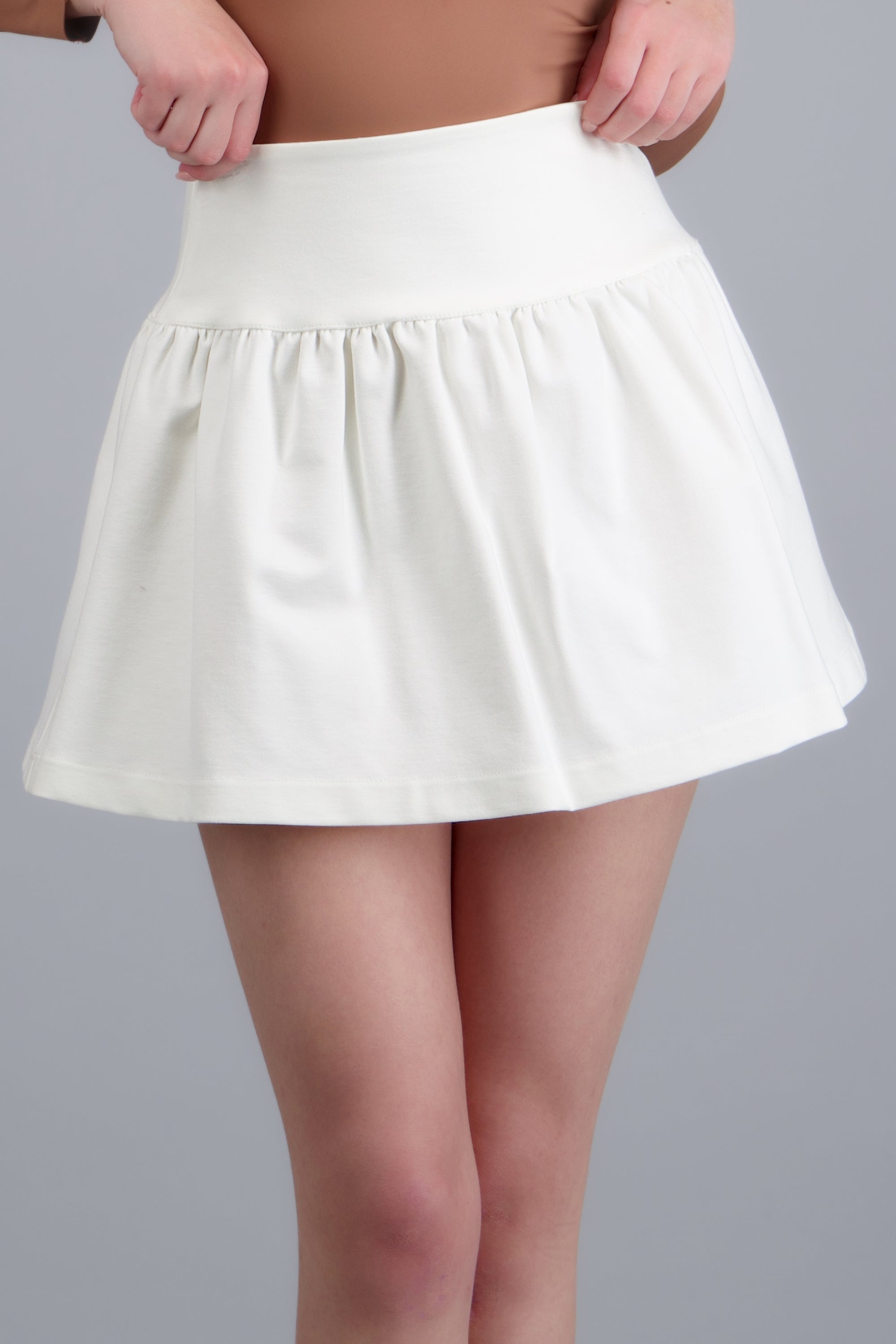 Falda mini tacto suave HUESO