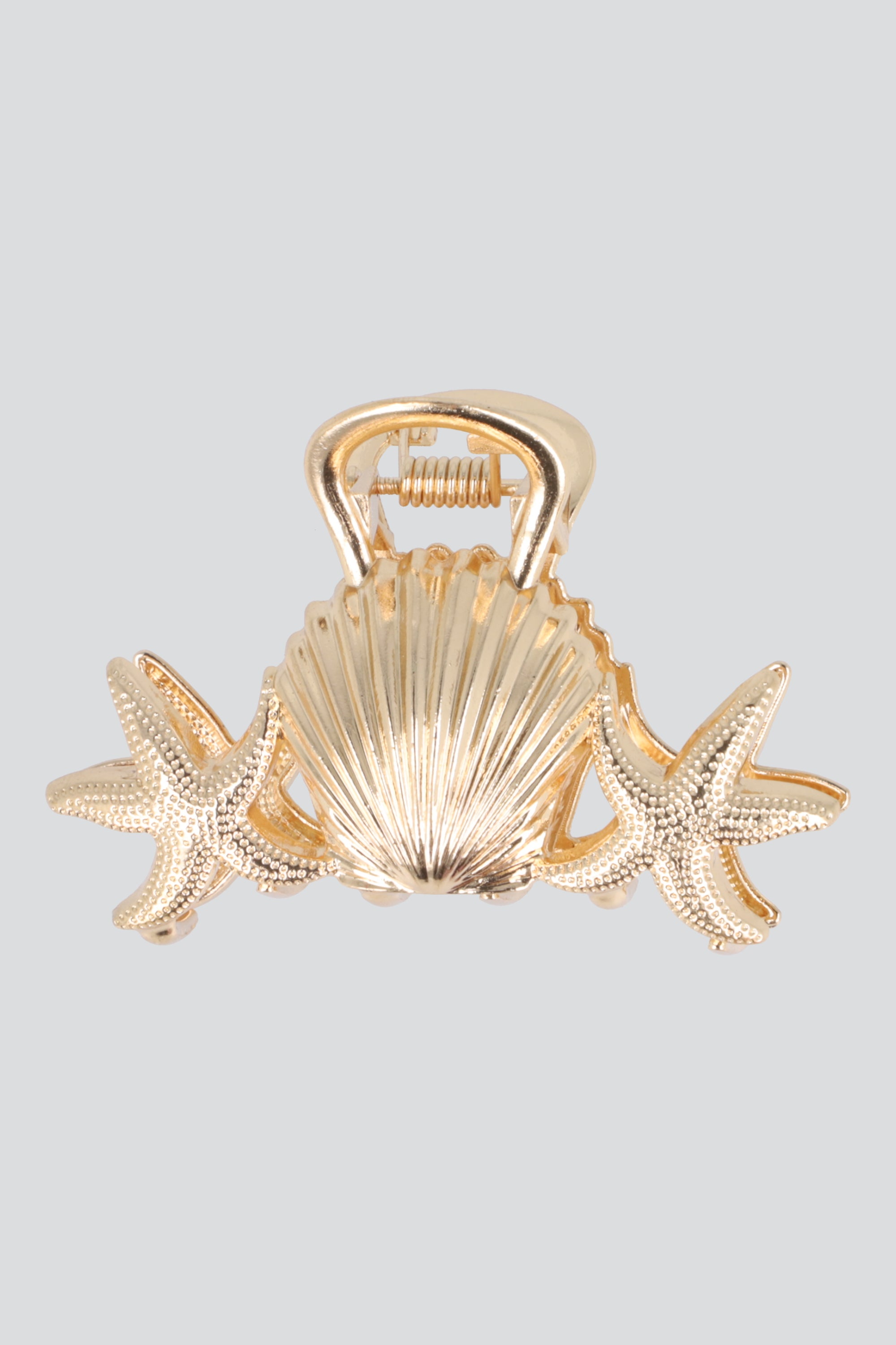 PINZA ESTRELLAS CONCHA METAL ORO