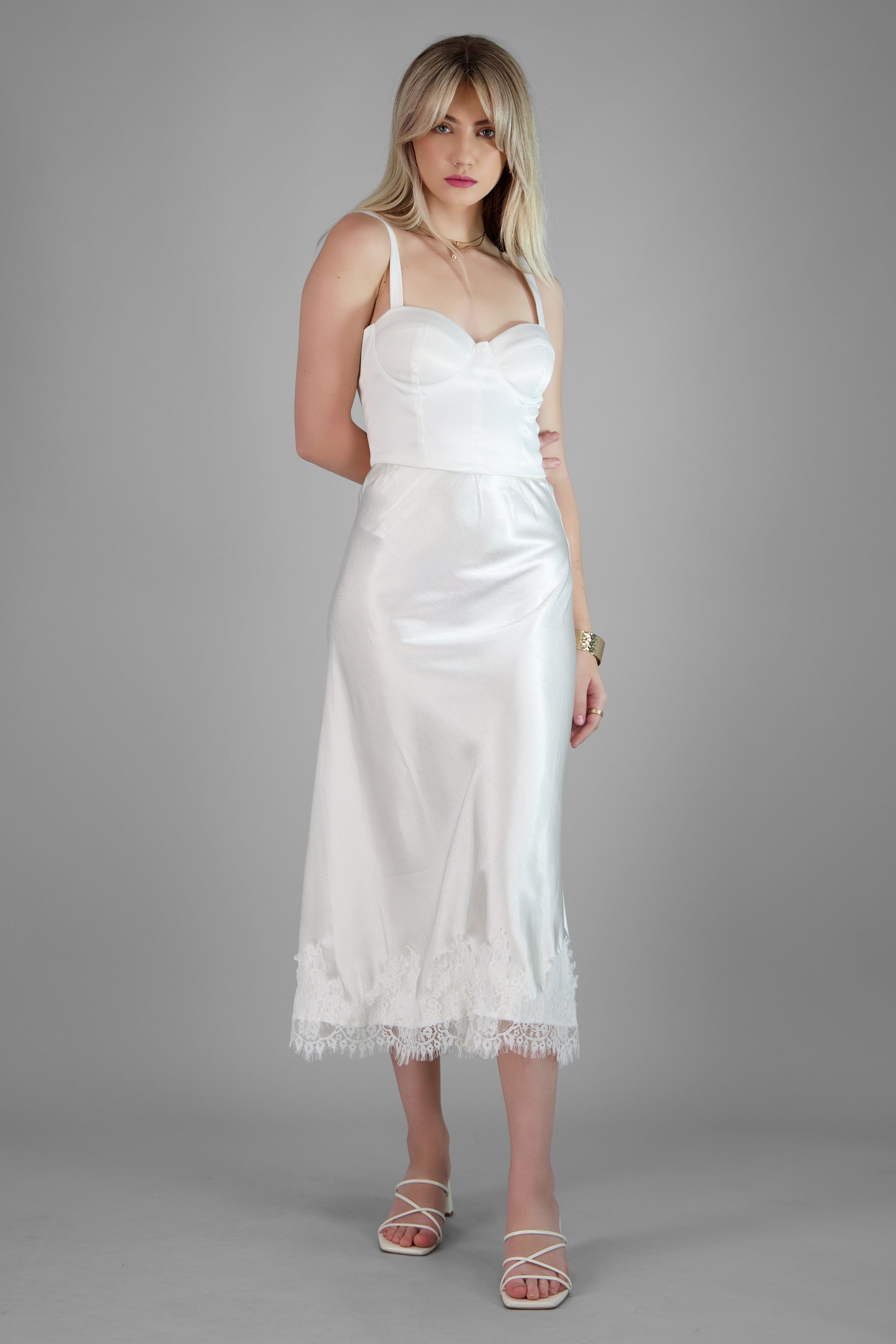 Falda satinada con detalle de encaje HUESO