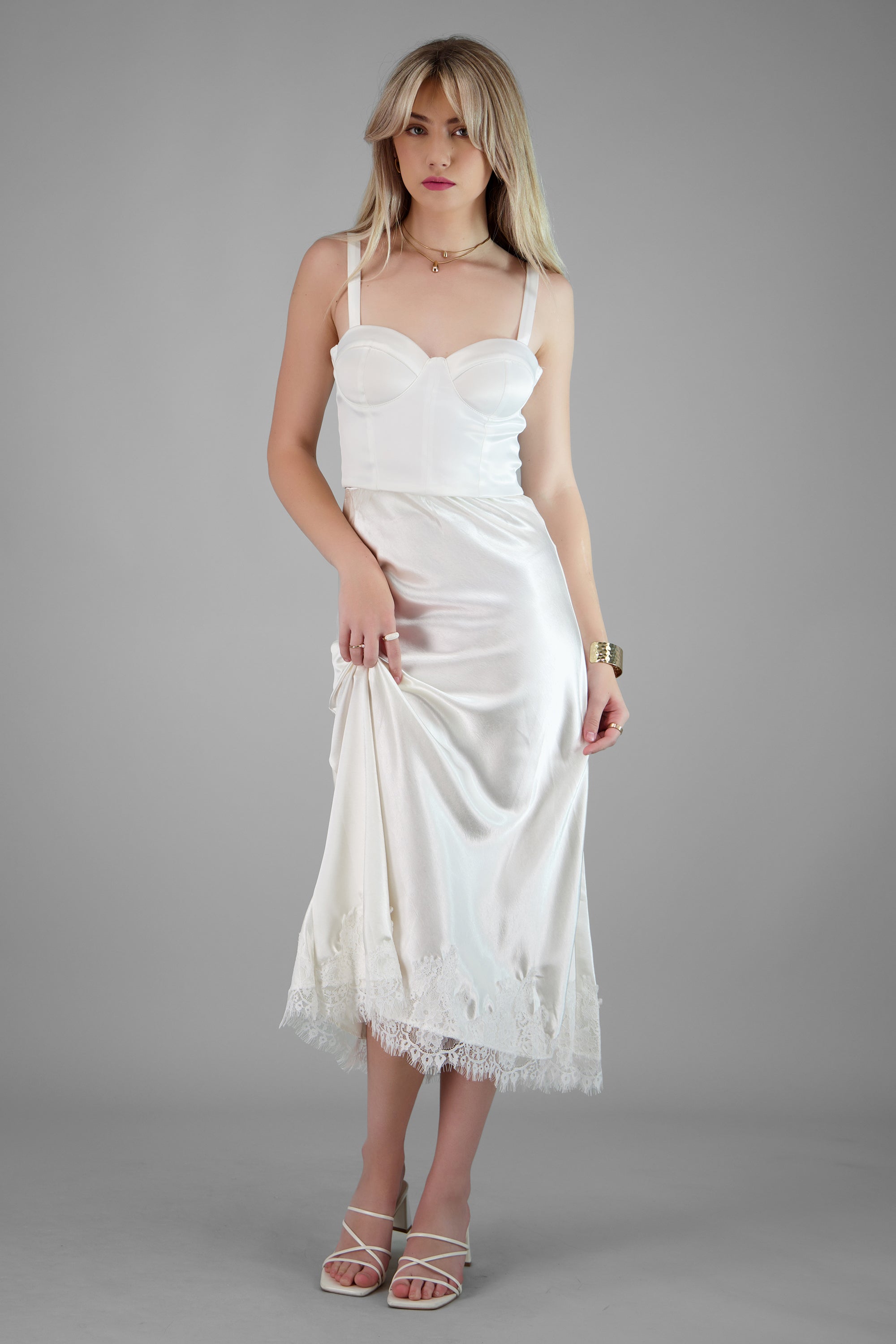 Falda satinada con detalle de encaje HUESO