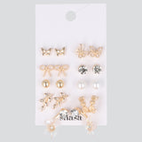Set 9 pares aretes flor