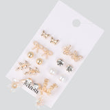 Set 9 pares aretes flor