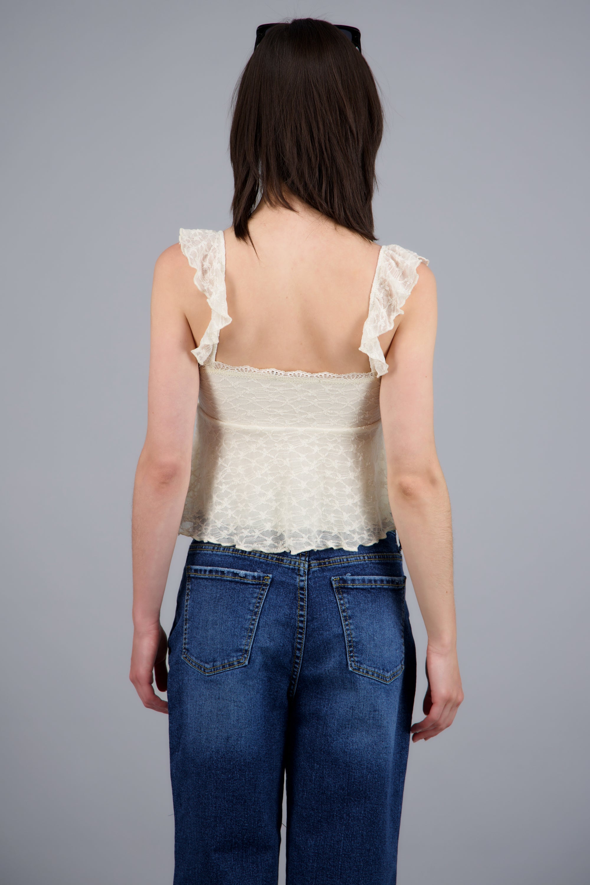 Blusa sin mangas detalle moño con copas CREMA