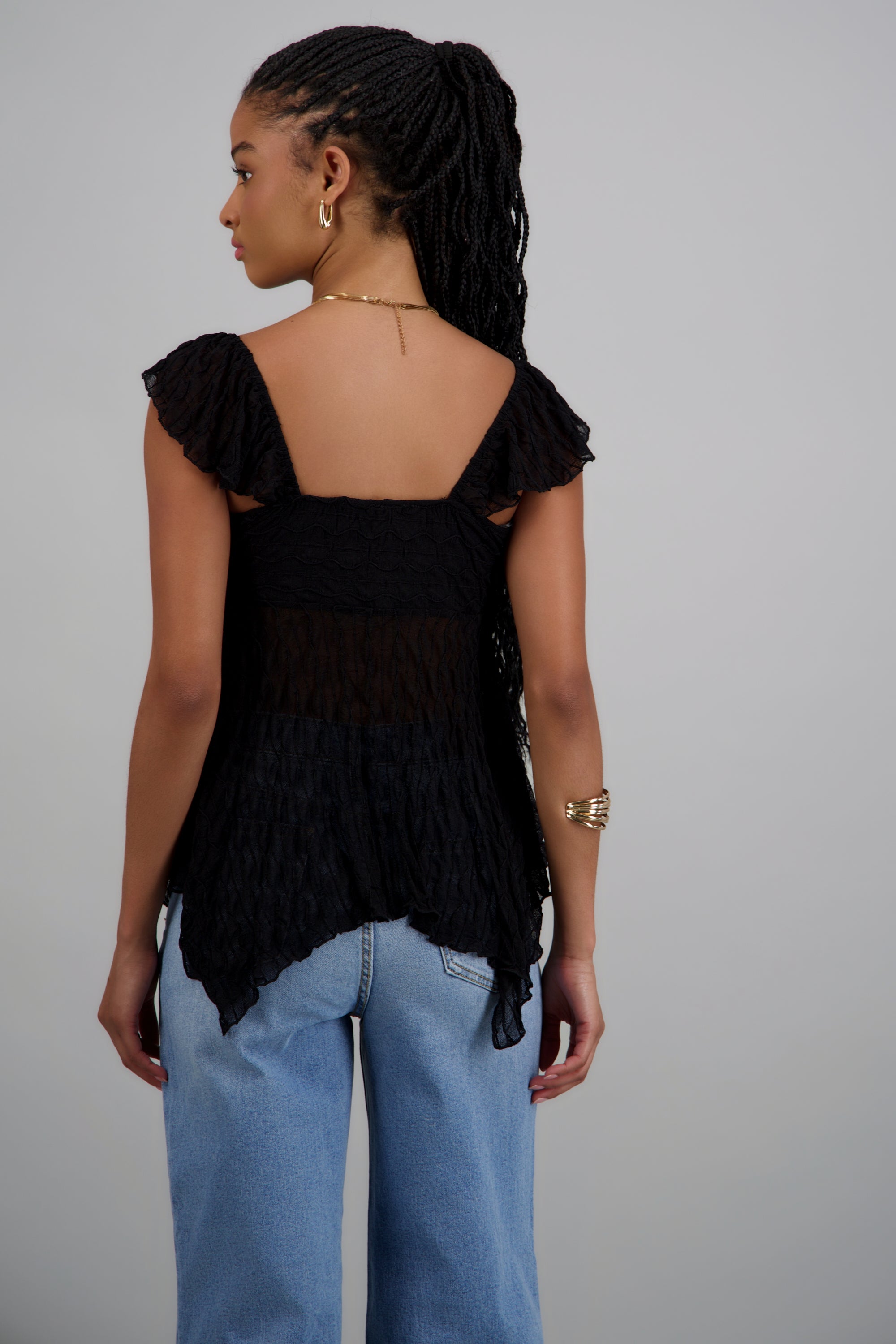 Blusa sin manga asimetrica con textura NEGRO