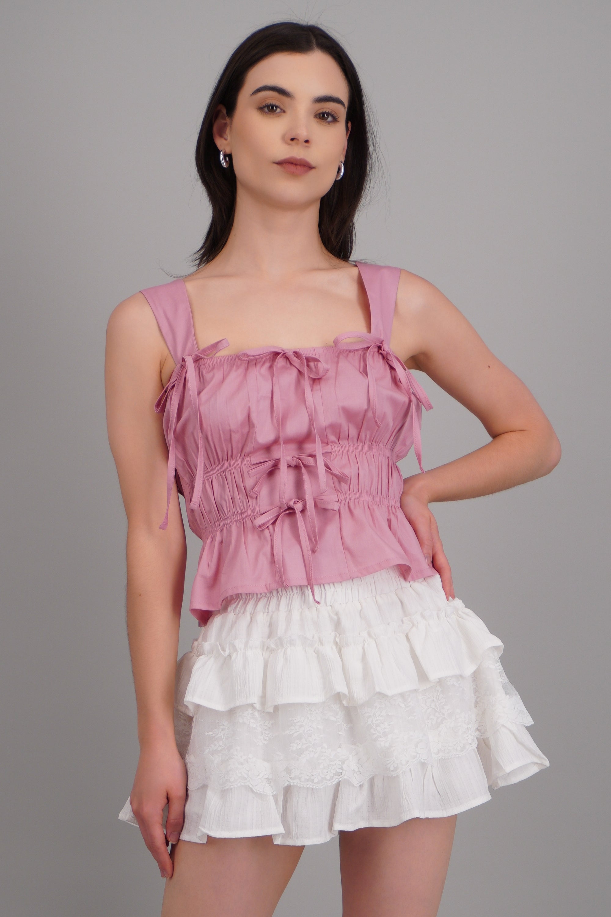 Top sin mangas detalle moños ROSA PASTEL