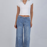 Jeans wide leg detalle flores bordadas