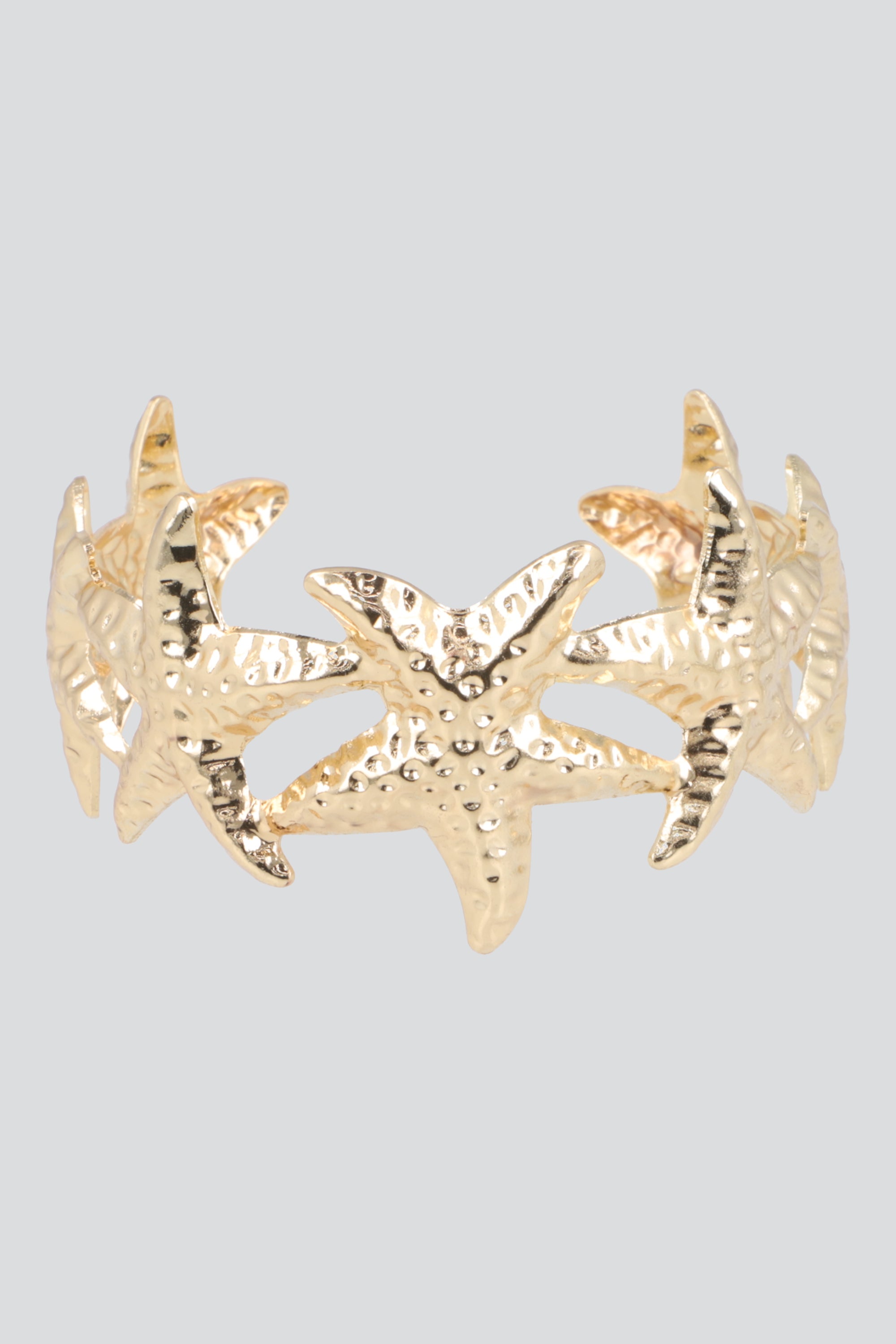 Cuff multi estrellas de mar metal ORO