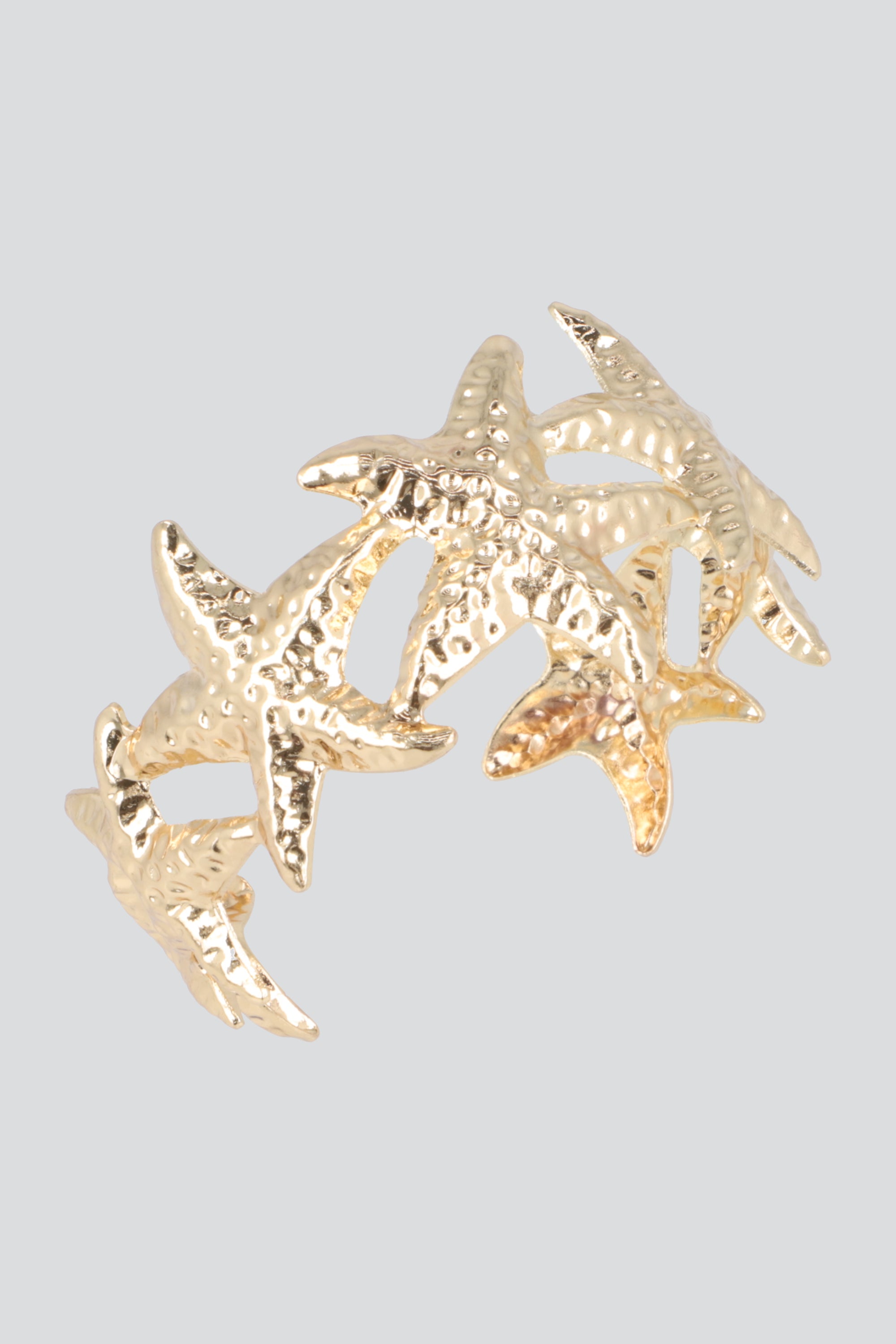 Cuff multi estrellas de mar metal ORO