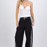 Pantalones pretina contraste con rayas al costado