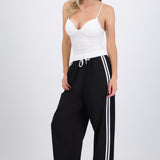Pantalones pretina contraste con rayas al costado
