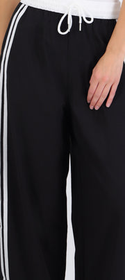 Pantalones pretina contraste con rayas al costado