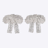 Aretes moños maxi brillos