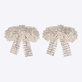 Aretes moños maxi brillos